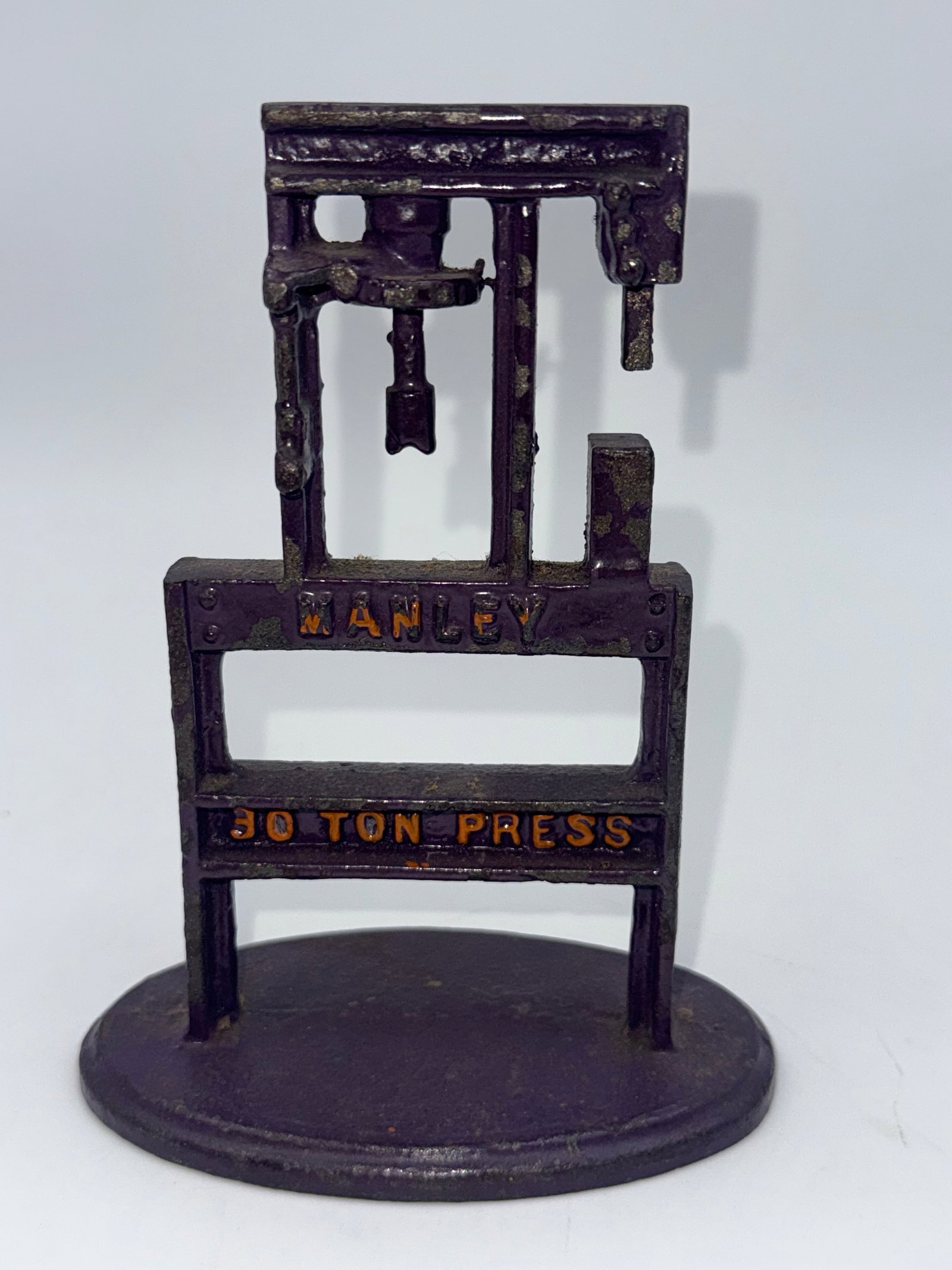 vintage miniature cast iron Manley 30 Ton Press salesman sample or desk top model: The full-sized presses were originally manufactured by the Manley typically date to the 1920s or 1930s.
