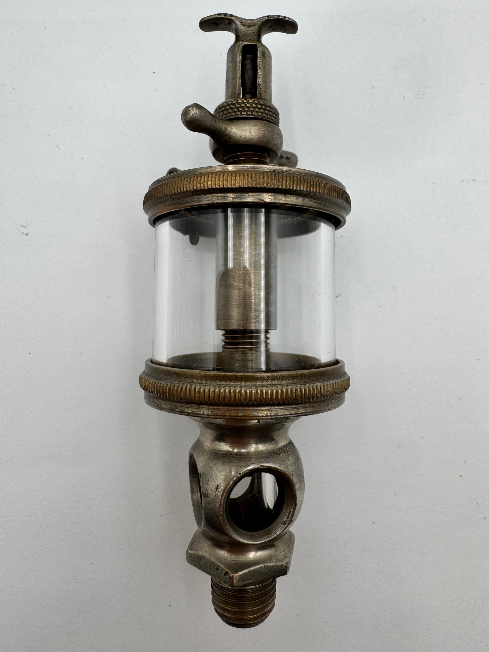 Antique Buckeye Brass Steam Engine Oiler Lubricator Sight Feed Glass Reservoir: Antique Buckeye steam engine lubricator/oiler with heavy brass and nickel-plated construction, clear glass sight-feed reservoir, and adjustable drip-feed mechanism. Marked “Buckeye” on the top