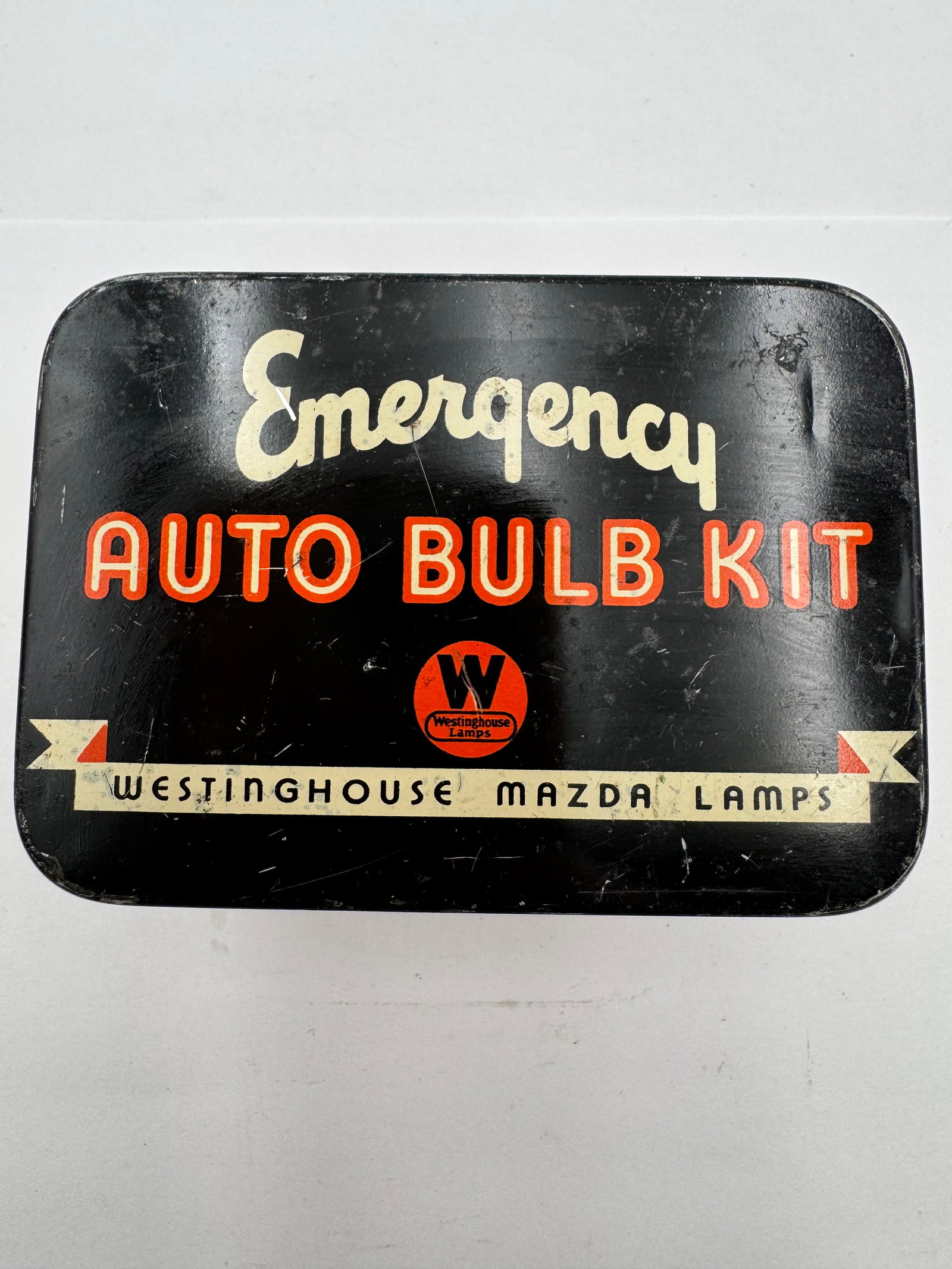 Vintage Westinghouse Mazda Lamps Emergency Auto Bulb Kit Tin: Vintage Westinghouse Mazda Lamps “Emergency Auto Bulb Kit” advertising tin with striking black, cream, and orange Art Deco graphics. These early automobile bulb kits were designed to store rep