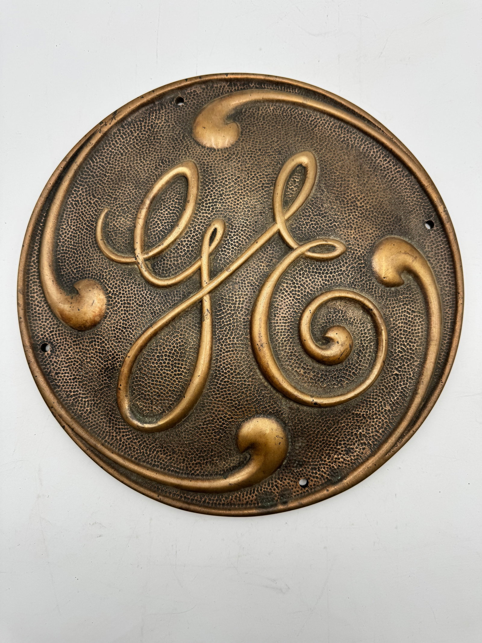 Antique GE General Electric Bronze Cast Iron Plaque Sign: Original antique General Electric (GE) industrial plaque/sign with ornate raised script lettering and textured background. Heavy cast metal construction with mounting holes and back casting number 379