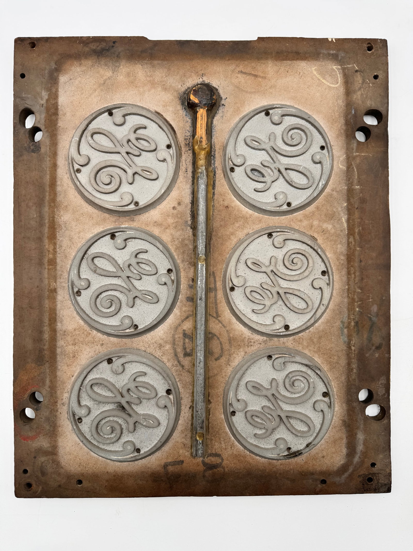 Rare GE General Electric Foundry Mold Pattern Plate: Rare original General Electric (GE) cast metal and wood foundry mold/pattern plate from a former GE manufacturing facility. Features six classic GE script emblem molds with visible production/casting 