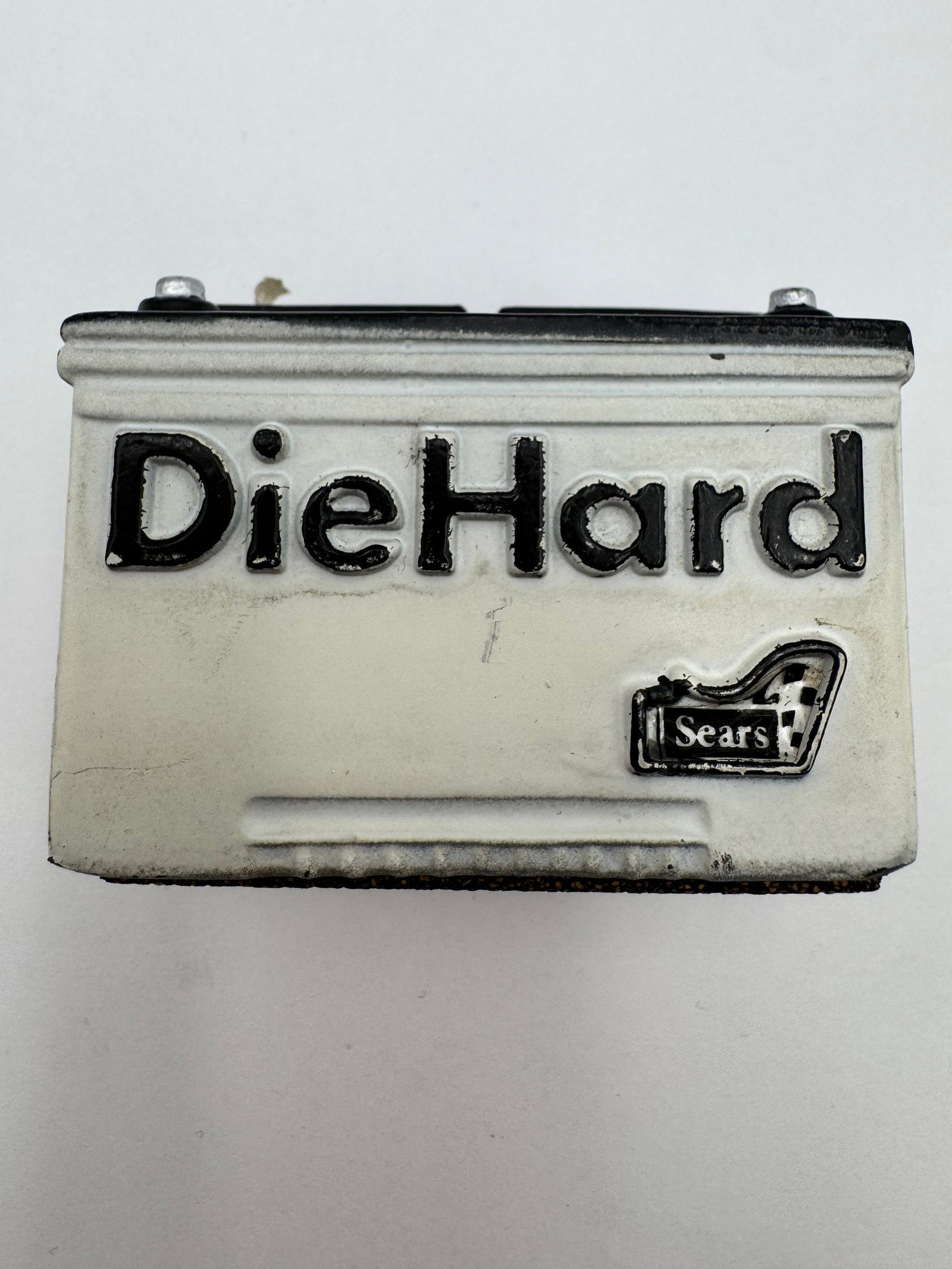 Vintage Sears DieHard Battery Tape Dispenser Advertising Desk Accessory: Vintage Sears DieHard battery advertising tape dispenser/desk accessory in the form of an automotive battery. Features raised “DieHard” lettering with Sears logo, black and white color scheme,