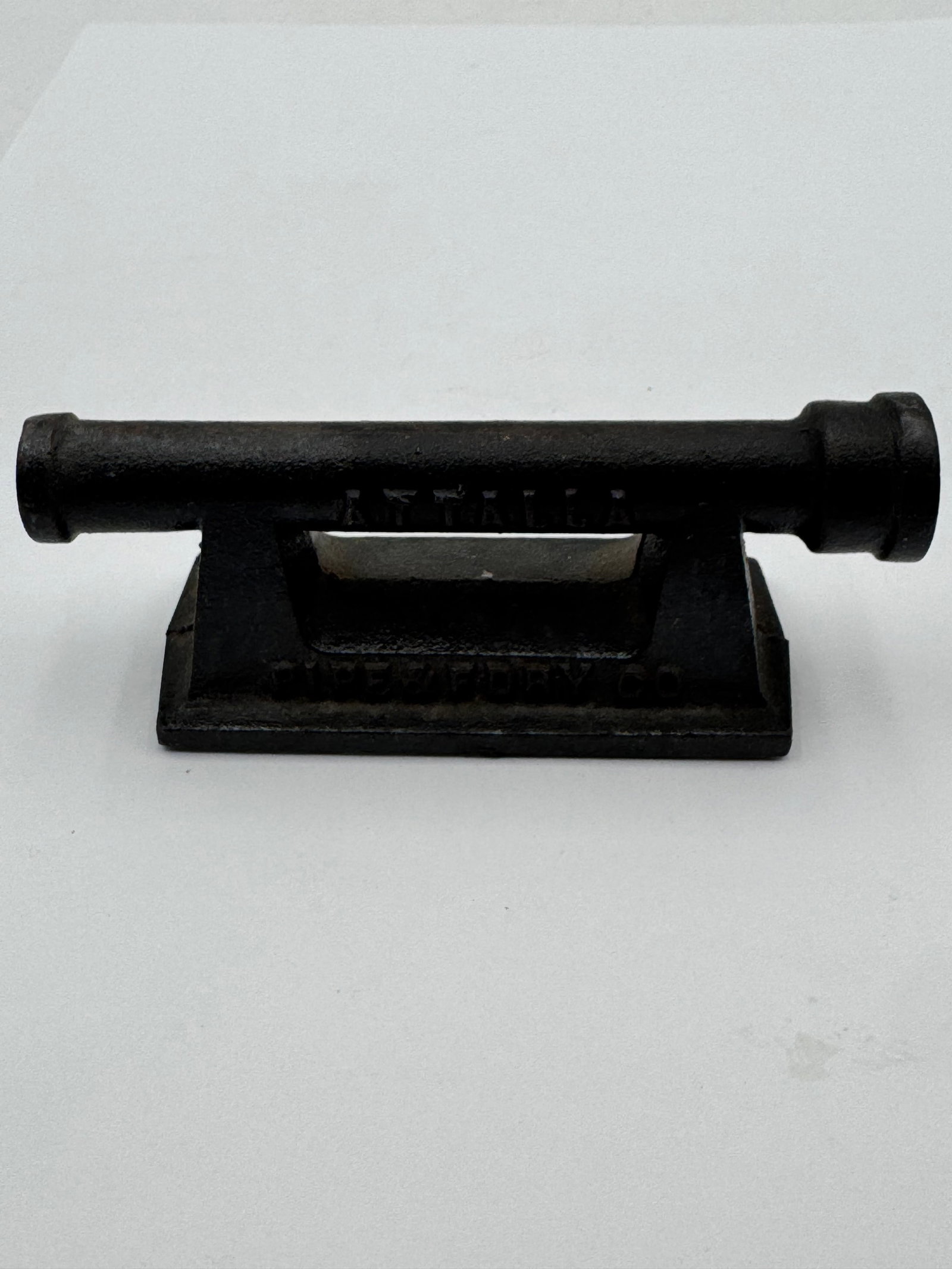 Antique ATTALLA Pipe & Foundry Co Cast Iron Industrial Advertising Desk Piece: Rare vintage cast iron advertising piece from Attalla Pipe & Foundry Co. featuring a cannon-form industrial design with raised “ATTALLA” and “PIPE & FDRY CO” lettering. Heavy cast cons