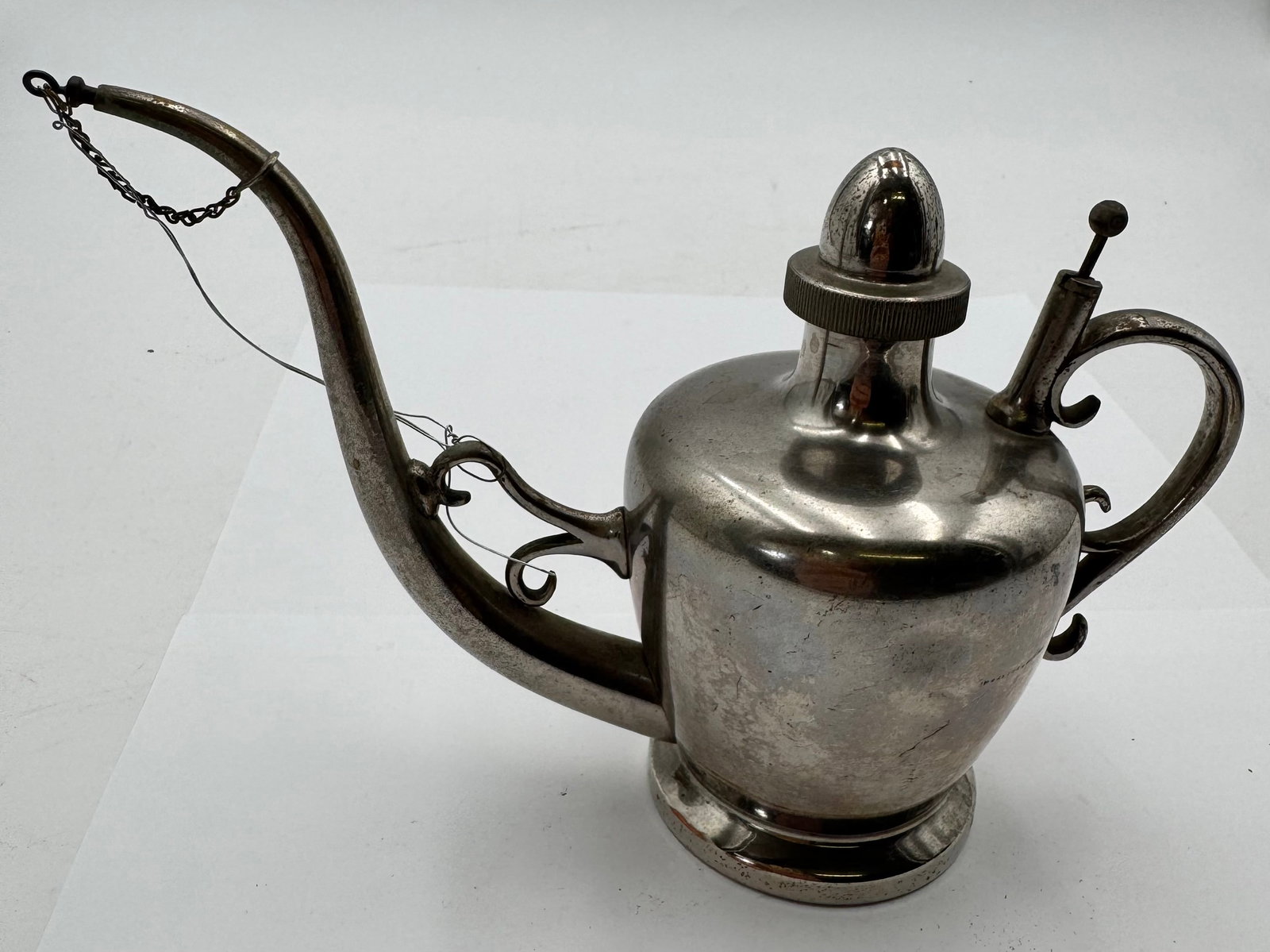 Vintage Sternau & Co Silverplate Art Deco Syrup Pitcher Creamer w Lid: Elegant vintage silverplate syrup pitcher or small serving pot by Sternau & Co., featuring graceful Art Deco styling with decorative scroll handles and original fitted lid.Marked on underside:*