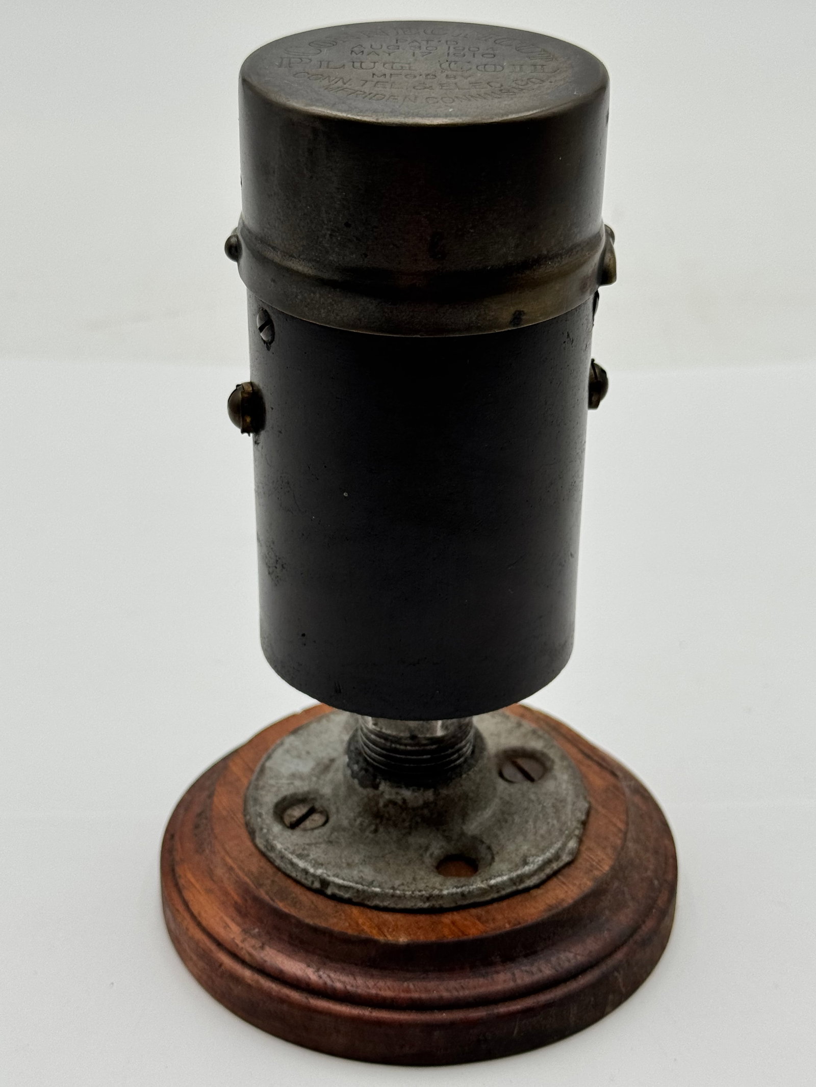 Antique Connecticut Plug Coil Ignition Coil Meriden CT Pat 1904 1910 Wood Base: Original antique Connecticut Plug Coil manufactured by Conn. Tel & Elec. Co., Meriden, Connecticut, USA. This early ignition/electrical component is mounted on its original turned wood display base an