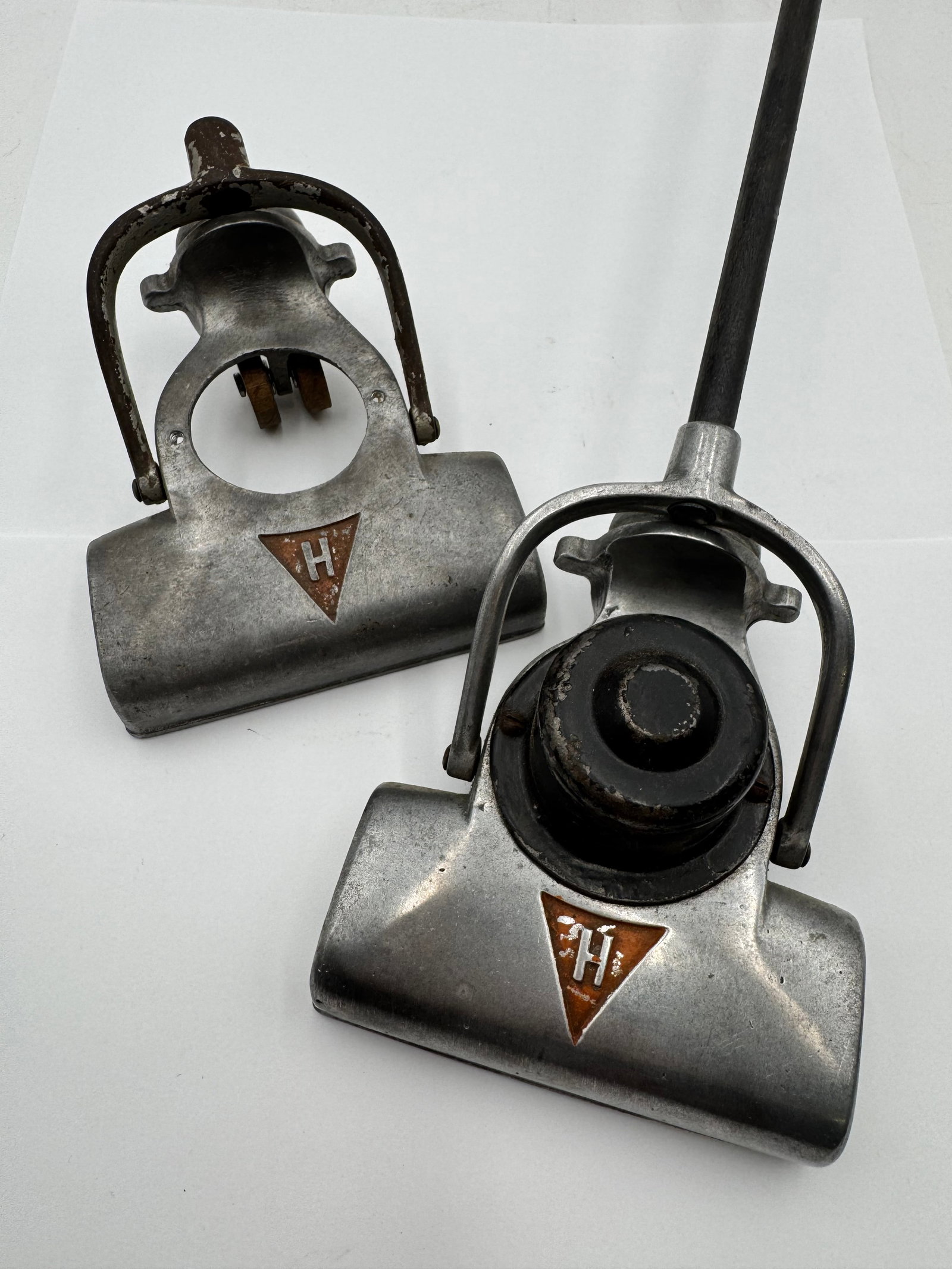 Vintage Industrial Aluminum Vacuum Cleaner Floor Head Attachment Pat 191242: Vintage industrial vacuum cleaner floor head attachment featuring a cast aluminum body with black center housing and original handle mount. Marked with triangular “H” emblem and patent number 