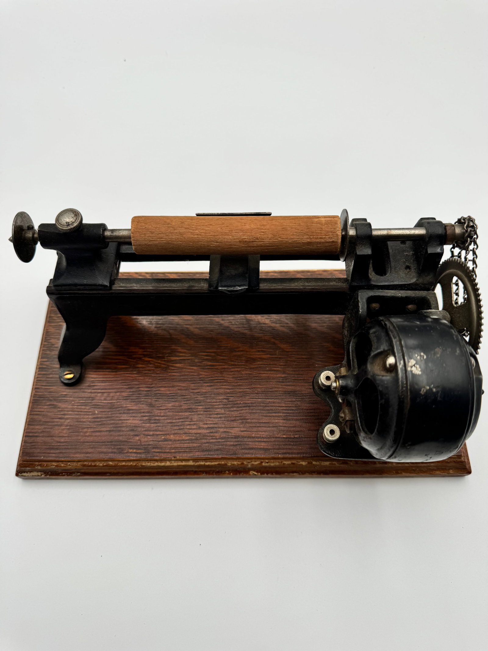 Antique Electromagnetic Motor Scientific Apparatus: Antique electromagnetic laboratory apparatus featuring cloth-wrapped coils, iron magnetic arms, rotating shaft assembly, and heavy cast iron base. Likely used as an early electric motor or scientific