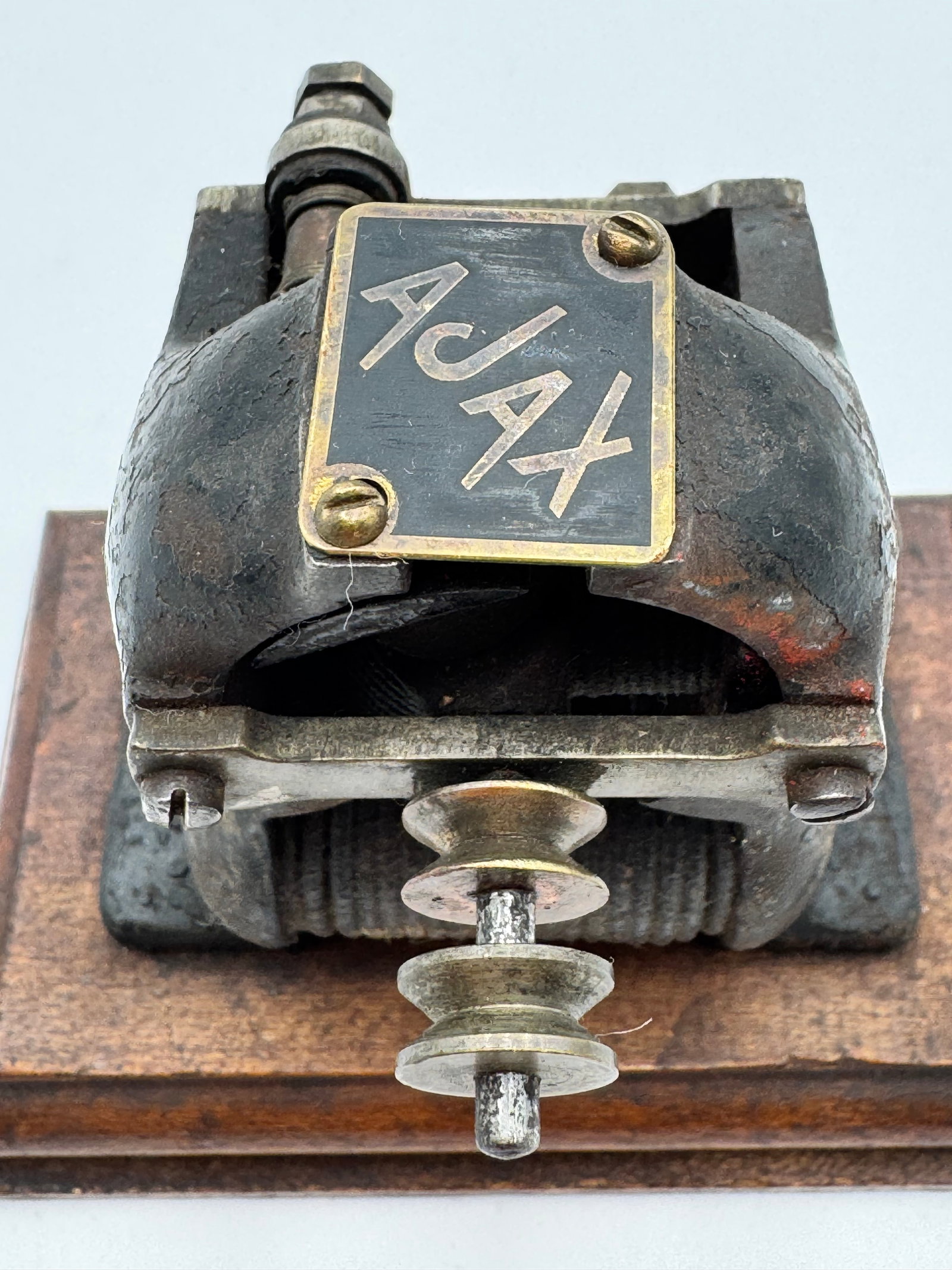 AJAX Antique demonstration Electric Motor Scientific Apparatus: Rare antique AJAX demonstration electric motor dating to the early 1900s, featuring a heavy cast iron housing mounted on its original wooden base. This early bipolar motor includes original pulley