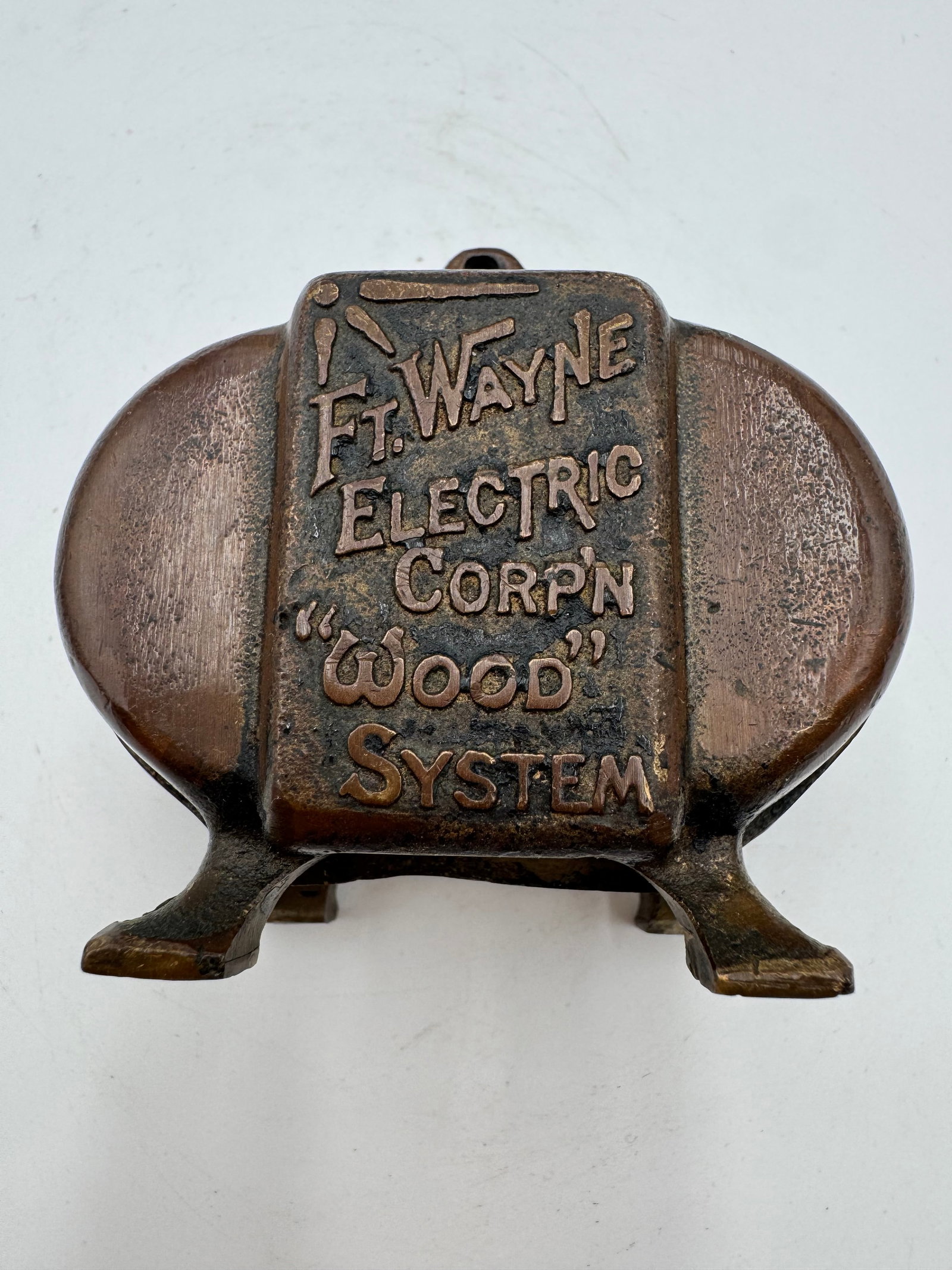 Antique Ft Wayne Electric Corp “Wood System” Copper Advertising Paperweight: Rare antique advertising paperweight for Ft. Wayne Electric Corp featuring raised “Wood System” lettering in a heavy copper-tone metal body. Industrial electric utility related collectible wit