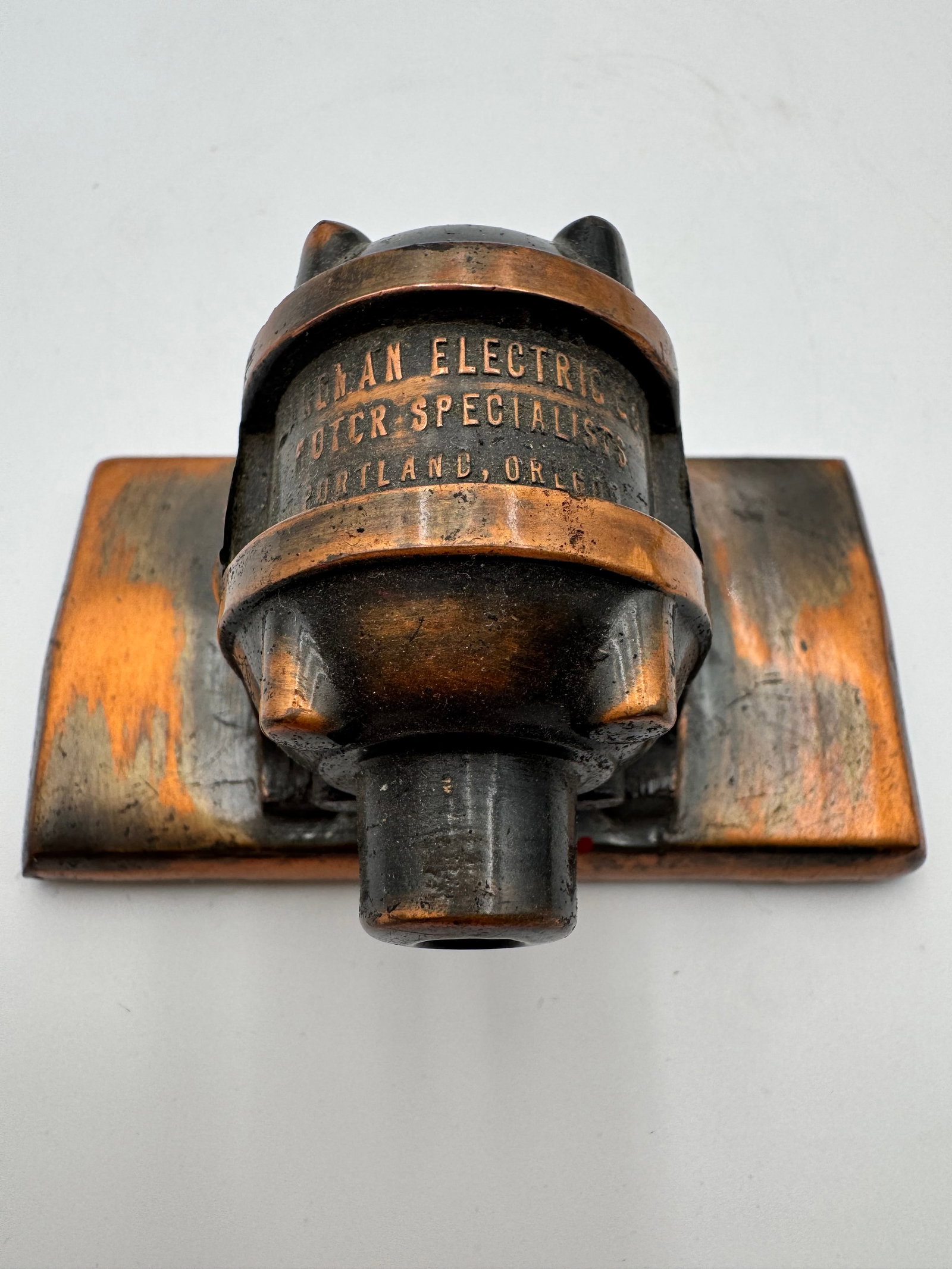 Antique motor Advertising Paperweight: Antique copper-tone advertising paperweight marked “Electric Corp OTCR Specialists Portland, Oregon.” Heavy industrial-style desk piece with a beautiful aged copper and black patina. Features 