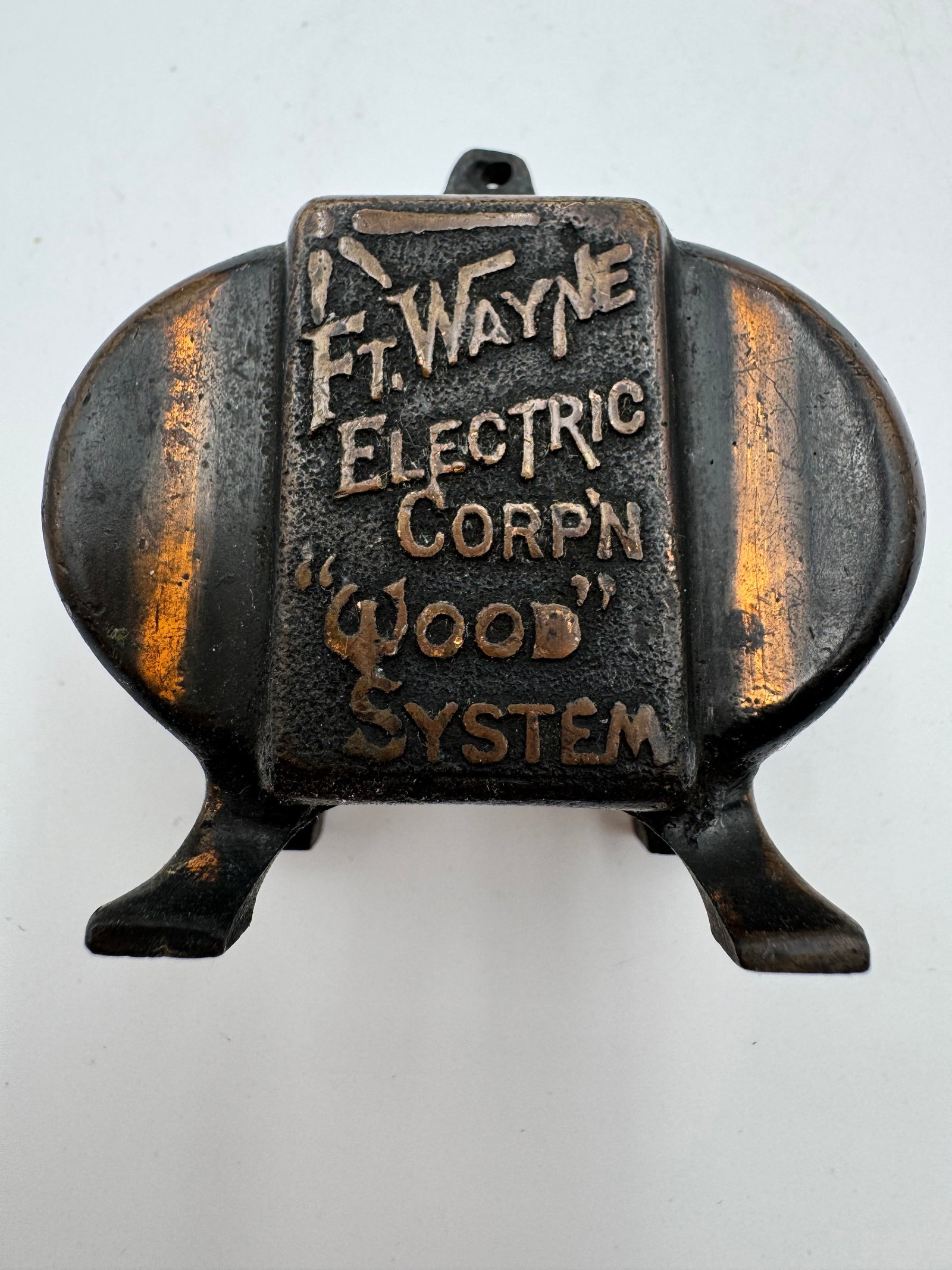 Antique Ft Wayne Electric Corp “Wood System” Copper Advertising Paperweight: Rare antique advertising paperweight for Ft. Wayne Electric Corp featuring raised “Wood System” lettering in a heavy copper-tone metal body. Industrial electric utility related collectible wit