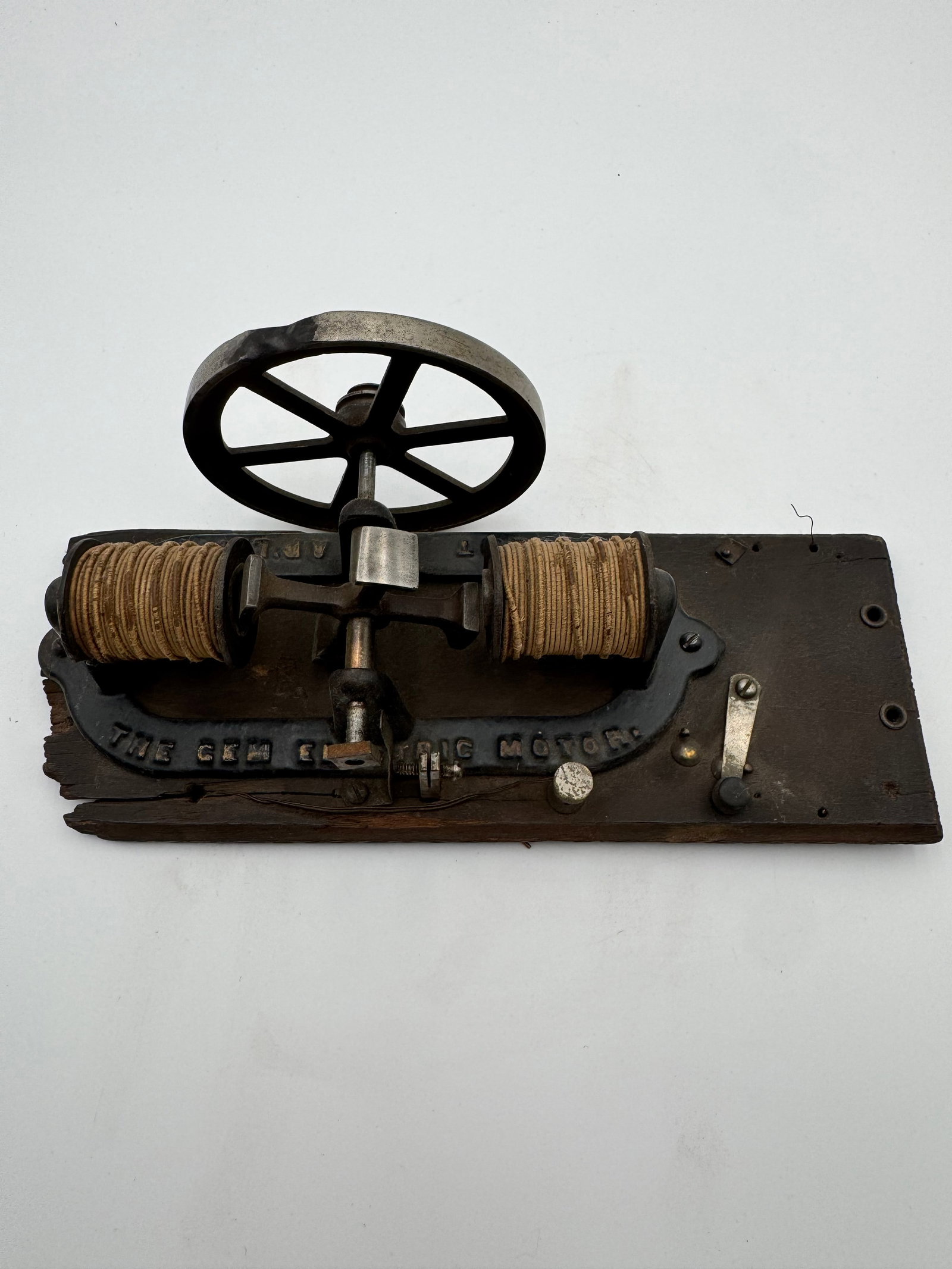 Antique “The Gem Electric Motor” Cast Iron Electric Motor Scientific Demonstration: Original antique “The Gem Electric Motor” mounted on wood base with exposed field coils, cast iron frame, flywheel, and early contact assembly. Dates to the late 19th or early 20th century and