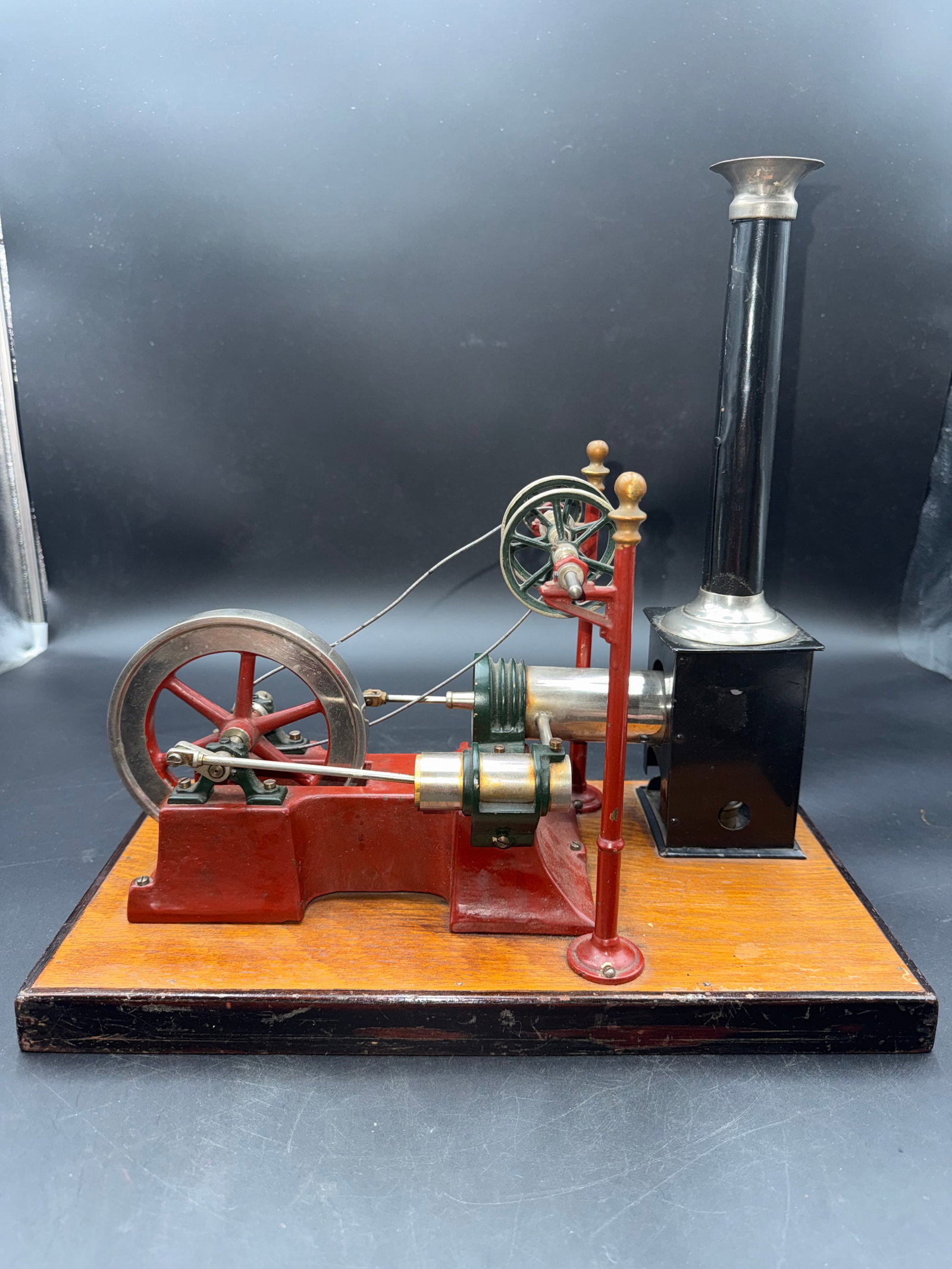 Early German Steam Engine by Georges Carette: Early metal steam engine with high transmission,complete with burner on nicely wooden base ,a rare example by Georges Carette,a French toy maker who set up his works in Germany in the late-19th centur