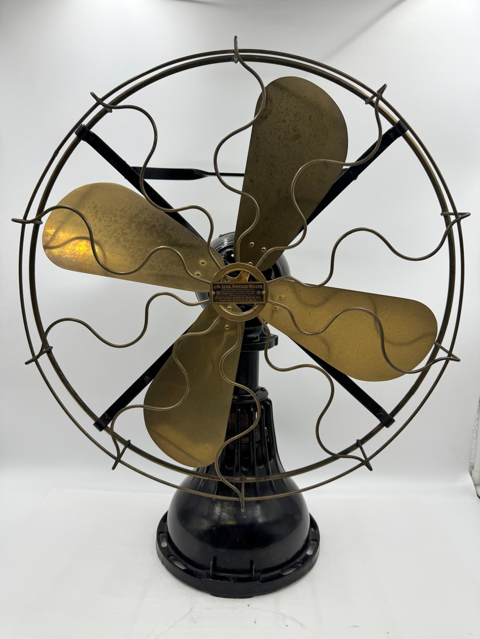 Alcohol powered or kerosene powered: Rare antique “Lake Breeze Motor” kerosene powered by The Lake Breeze Motor Co., Chicago, Illinois, U.S.A. Features four brass blades, ornate brass wire cage, and black cast iron base with