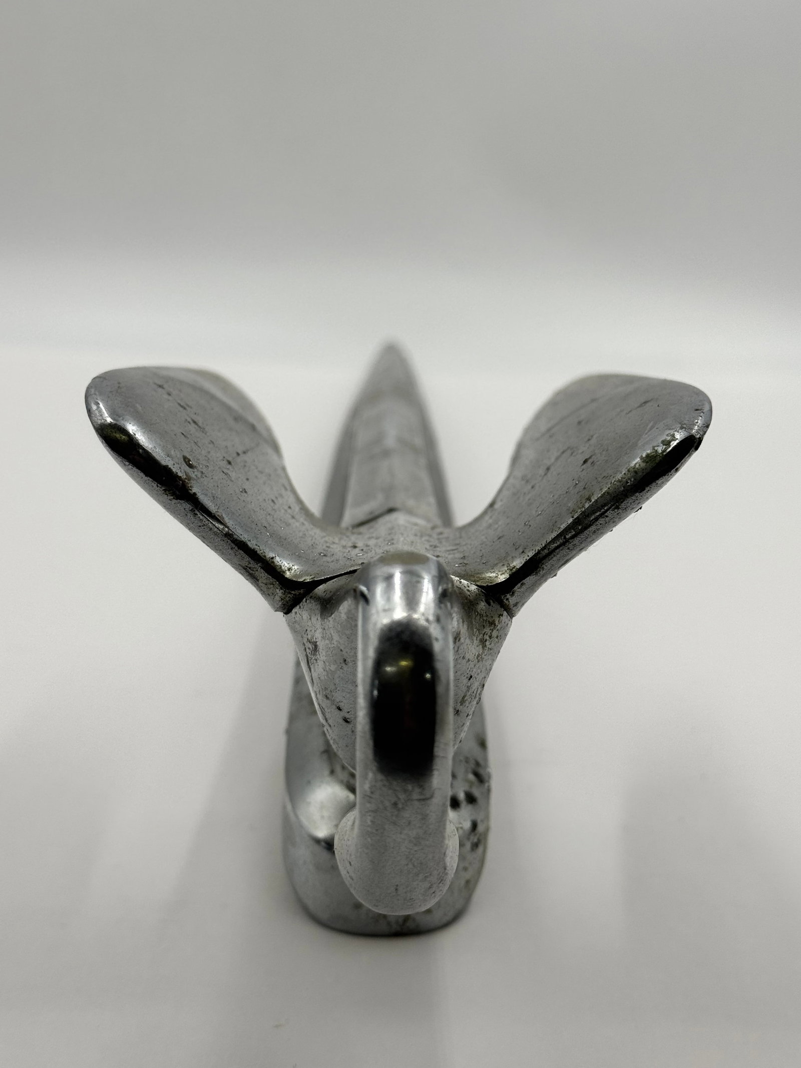1952-1954 Packard Swan Hood Ornament Chrome Mascot: Original vintage Packard swan hood ornament from the early 1950s, featuring elegant Art Deco styling with sweeping wings and curved neck design. Heavy chrome-plated cast metal mascot used on 1952–19