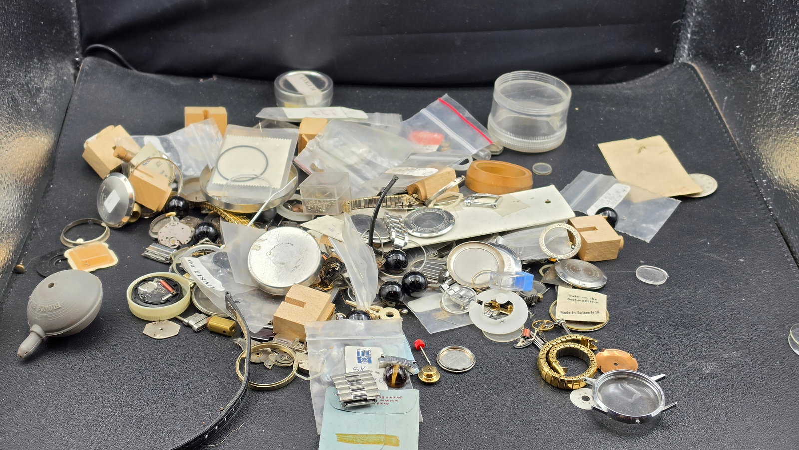 Vintage Watchmaker Parts Lot Cases Crystals Movements Tools Bestfit Esslinger NOS Swiss Shop Stock: This is a substantial vintage watchmaker's parts and supply lot sourced from a working watch repair shop, ideal for the hobbyist watchmaker, repair technician, or parts collector. Named and identifiab