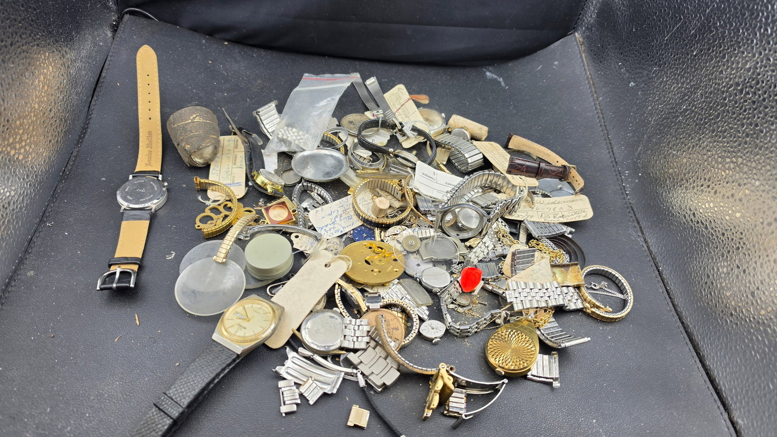 Vintage Watch Parts Lot Cases Dials Movements Bands Crystals Shop Tags Genuine Leather Repair Scrap: This is a vintage watchmaker's parts and repair lot sourced directly from a working watch shop, containing a wide variety of components and complete watch heads ideal for the repair technician, hobbyi