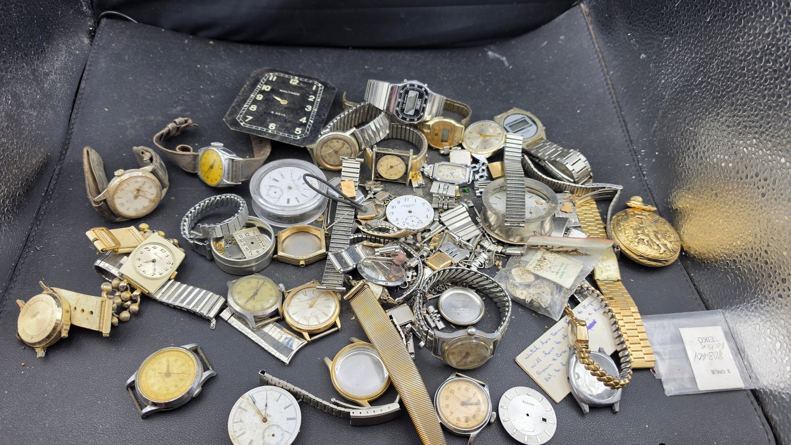 Vintage Watch Parts Lot Waltham 8-Day Bulova Seiko Sharp LCD Knickerbocker Lucerne Repair: This is a large vintage watchmaker's parts and repair lot sourced from a working watch shop, containing a wide mix of named brand watch heads, dials, movements, cases, and bands ideal for the collecto