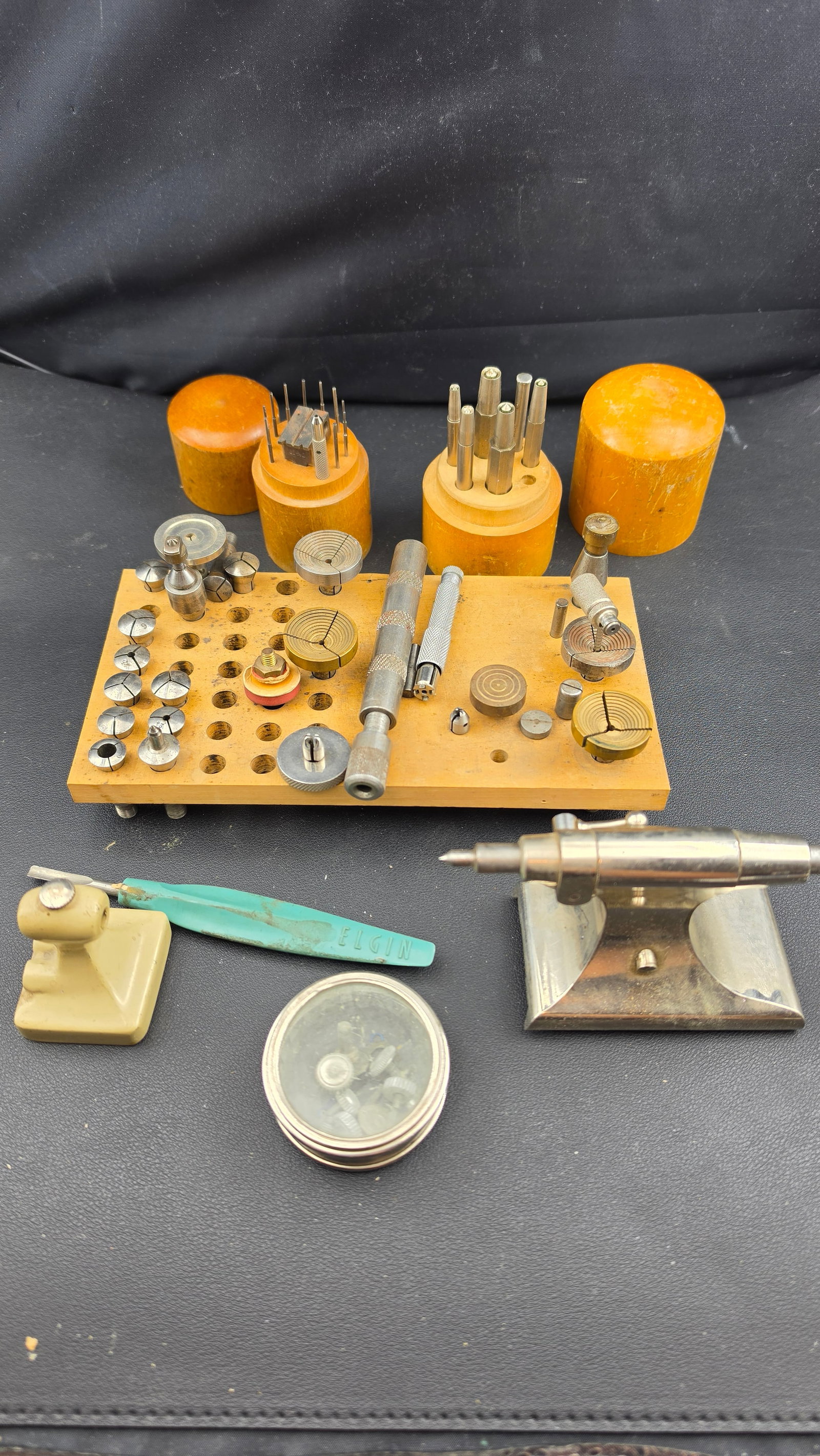 Vintage Wolf Jahn & Co. 8mm Watchmaker's Lathe Collet Collection & Bench Tool Set c. 1940s–1960s: This is a well-assembled collection of vintage watchmaker's bench tools representing the core precision tooling of a mid-20th century American watch repair shop. The centerpiece is a wooden collet sto