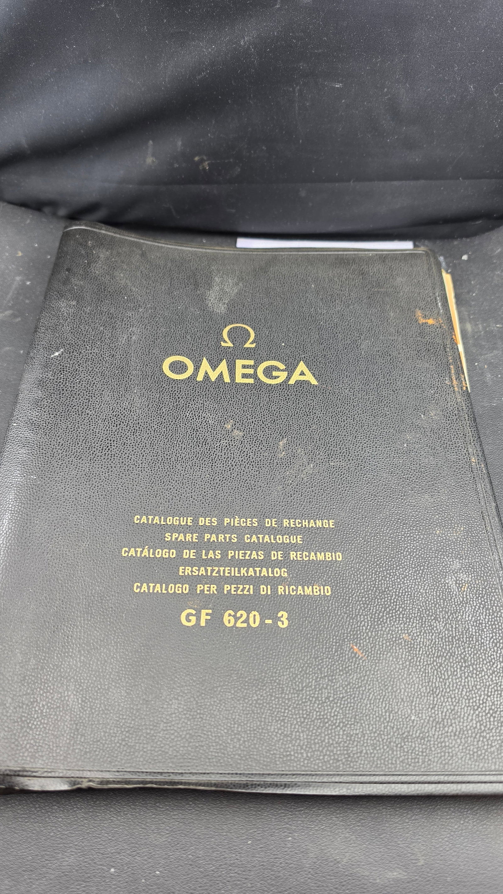 Omega Spare Parts Catalogue GF 620-3 Original Binder w/ Technical Guides Material Price List ca. 195: This is the official Omega Watch SA Spare Parts Catalogue GF 620-3 in its original black leatherette binder with gold-embossed Omega logo and the catalogue designation in five languages on the front c