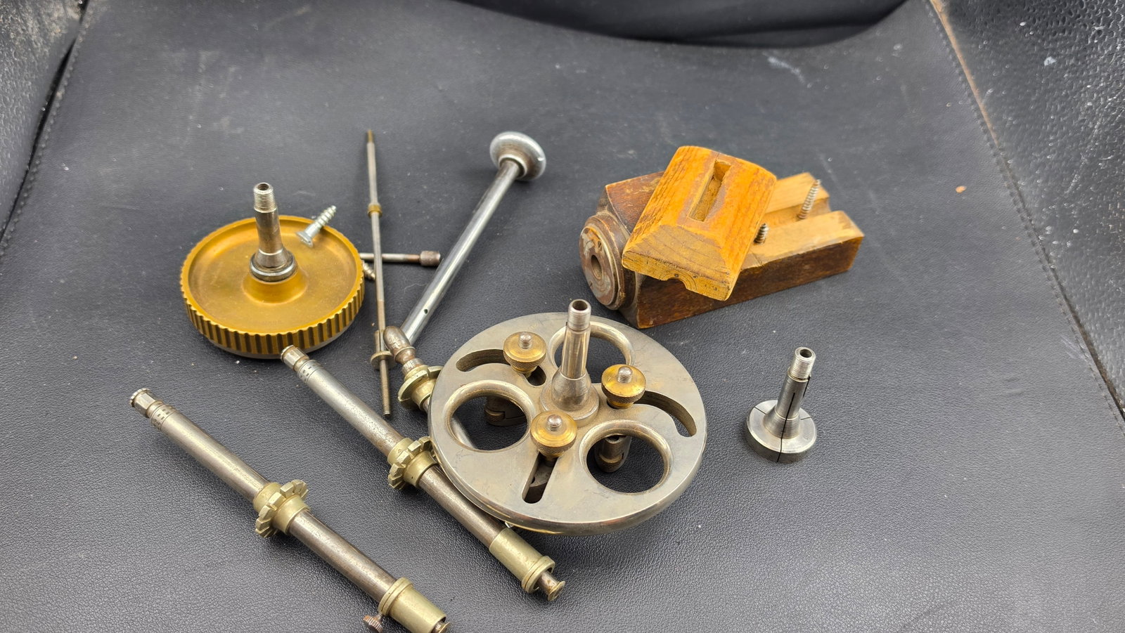 Antique Watchmaker's Lathe Accessories Lot Faceplate Spindles Step Collet Brass Gear Wood Vise Germa: This is a mixed lot of antique watchmaker's lathe accessories assembled from a professional shop, comprising several distinct pieces of tooling compatible with 8mm WW-pattern and Geneva-style watchmak