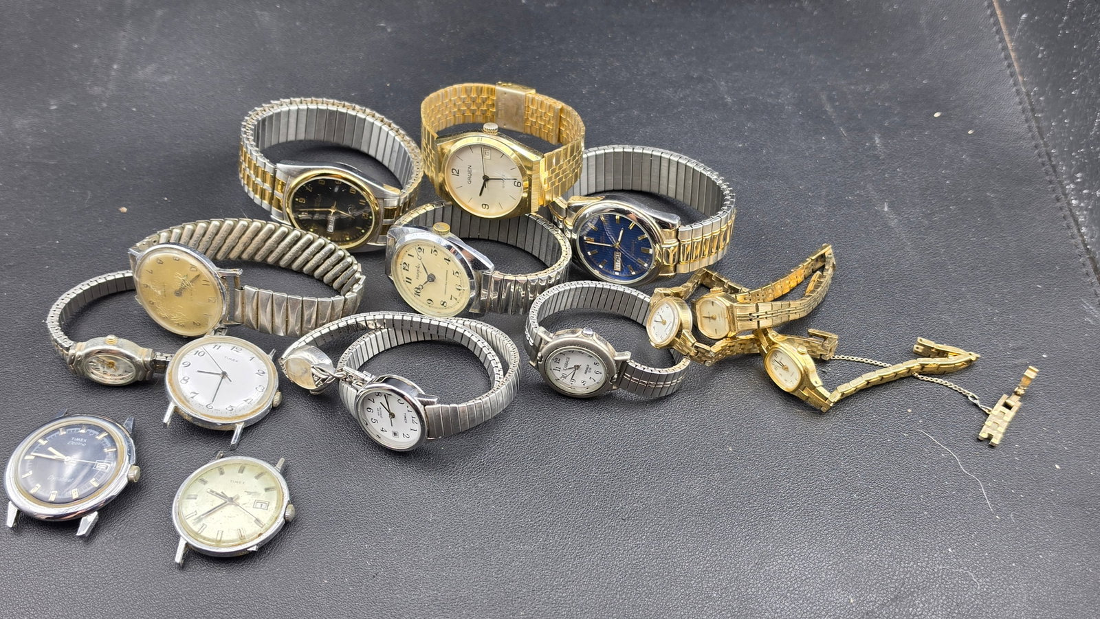 Lot of 15 Vintage Watches Timex Gruen Armitron Elgin Dynabeat Carriage Ladies Mens Mixed: This group lot brings together approximately fifteen vintage and collectible American wristwatches spanning roughly four decades of everyday and dress watch production. Included are a Gruen men's quar