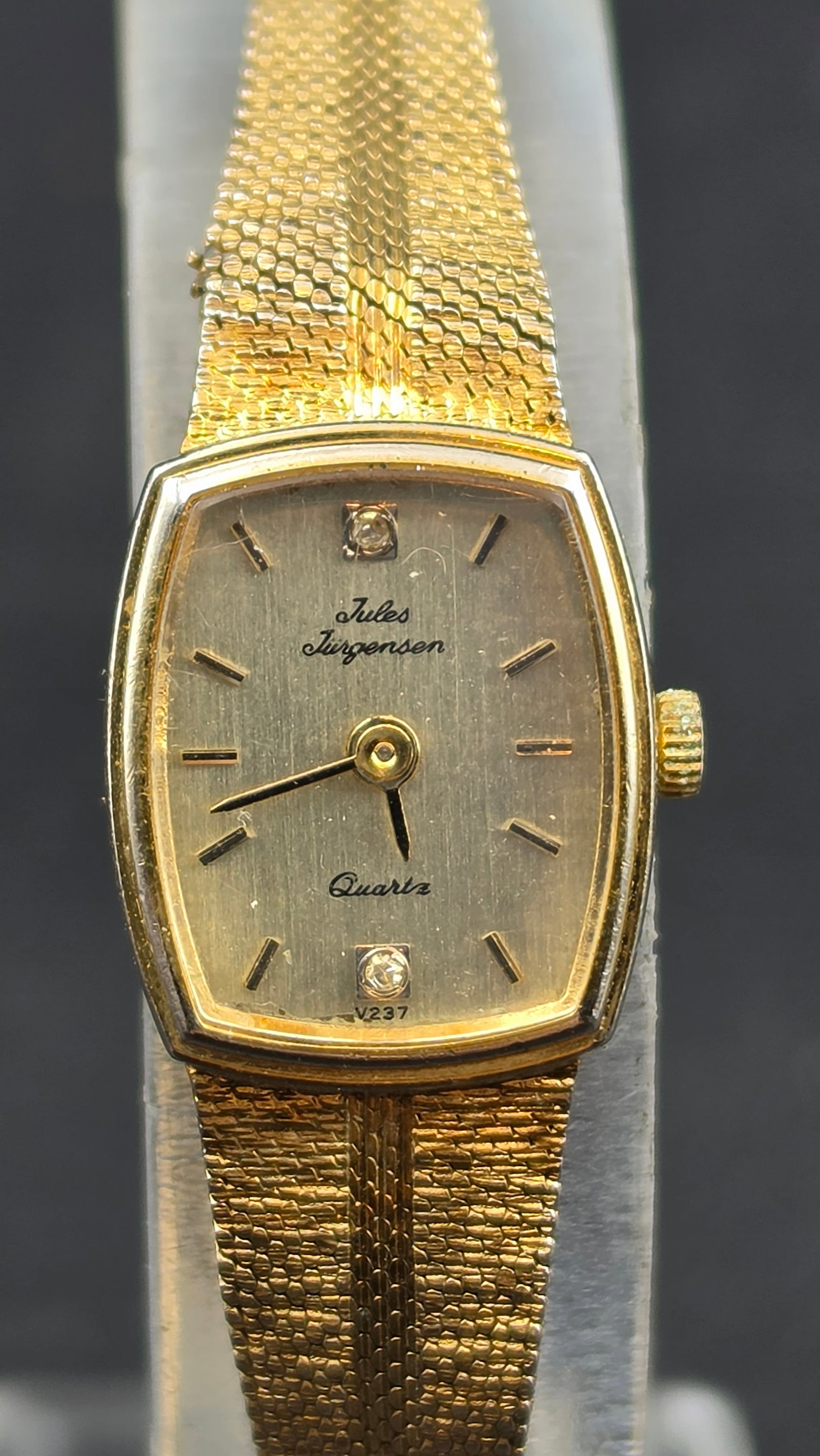 Vintage Jules Jurgensen Ladies Quartz Diamond Dial Ref V237 Gold-Tone Cushion Case Mesh Bracelet 198: This is a vintage Jules Jurgensen ladies' quartz dress watch in a cushion-shaped gold-tone case measuring approximately 15mm across, referencing caliber V237 as printed on the dial. The brushed champa