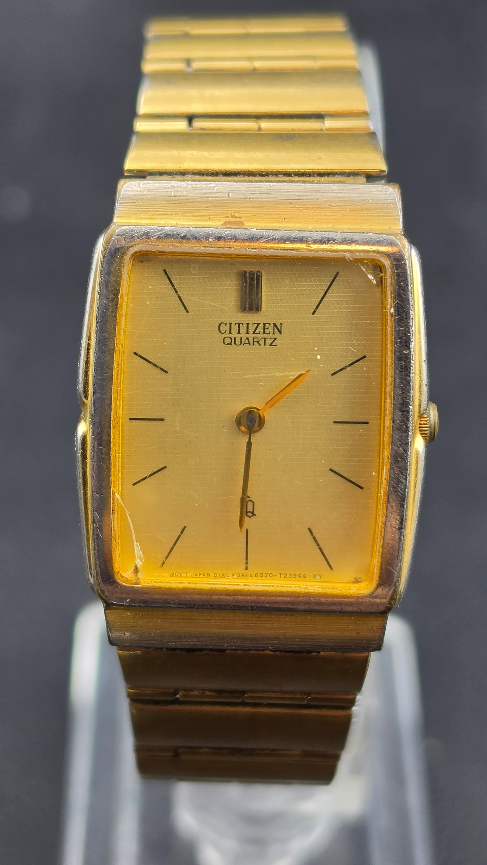 Citizen Quartz Men's Gold-Tone Dress Watch c.1980s Ref. 6020-915666 KT 25mm Rectangle Original Brace: Citizen is one of Japan's premier watch manufacturers, renowned for precision quartz movements and reliable construction. This slim rectangular dress watch represents the clean, minimalist design aest