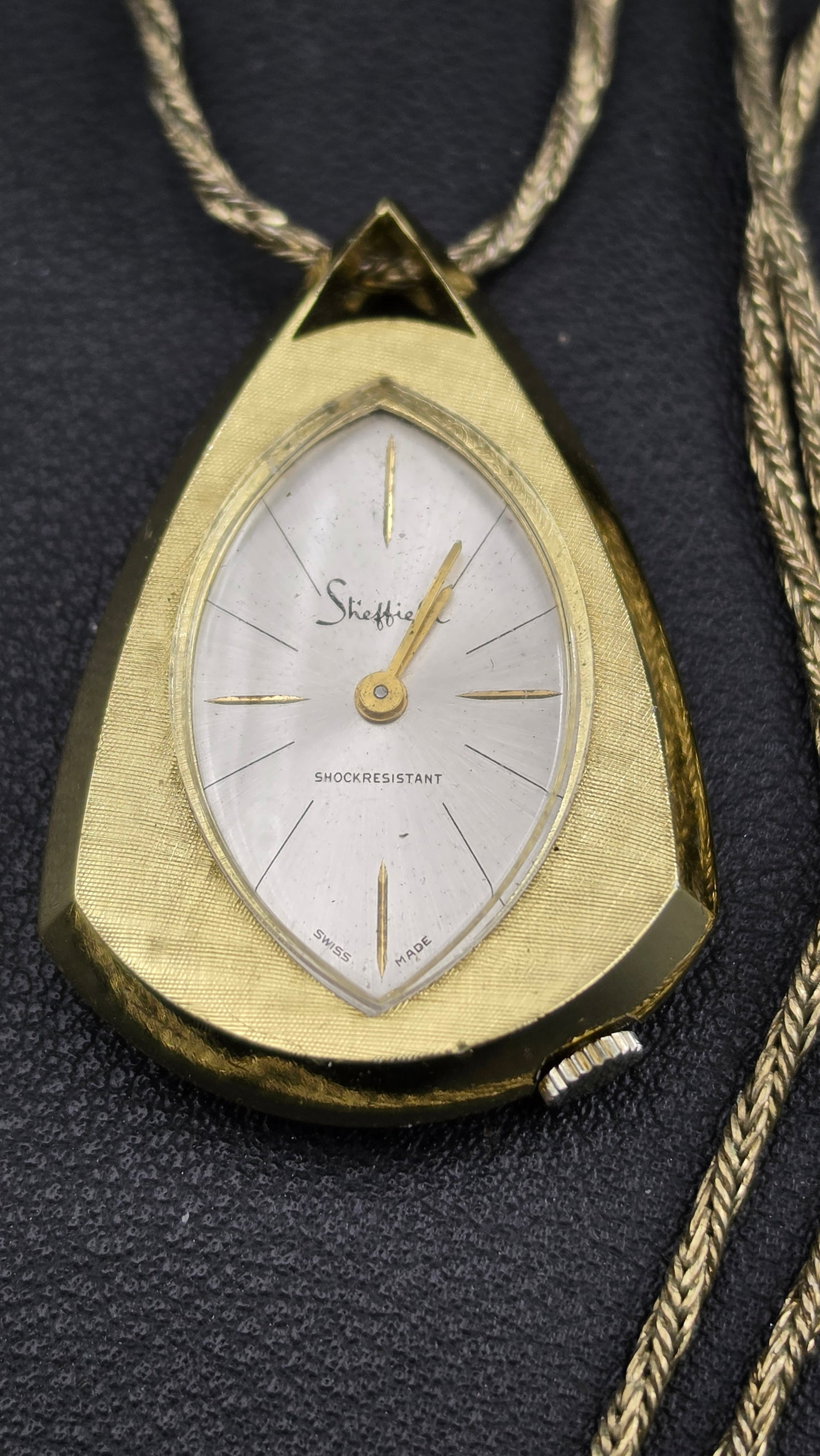 1965 Sheffield Watch Inc. Swiss Manual Wind Pendant Watch Necklace Teardrop Aluminum Case Runs: Up for sale is a vintage Sheffield Watch Inc. pendant necklace watch, Swiss-made, dating to approximately the mid-1960s based on the Mid-Century Modern teardrop case design and Sheffield's period of p