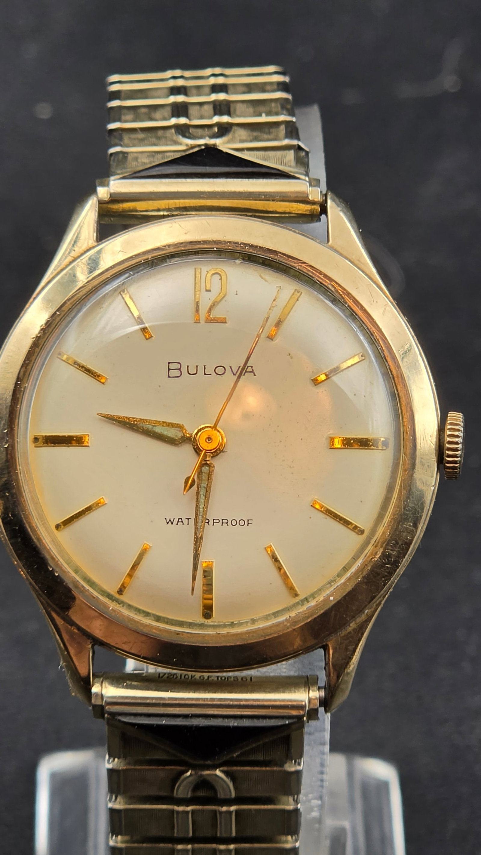 1961 Bulova 17-Jewel Manual Wind Men's Watch Cal. 11AFC 10K RGP 35mm: Up for sale is a 1961 Bulova manual-wind men's wristwatch, definitively dated by multiple period stampings — the case back engraving reads "Larry Jenneke / Xmas 61," the lug bars are stamped "1/20 1