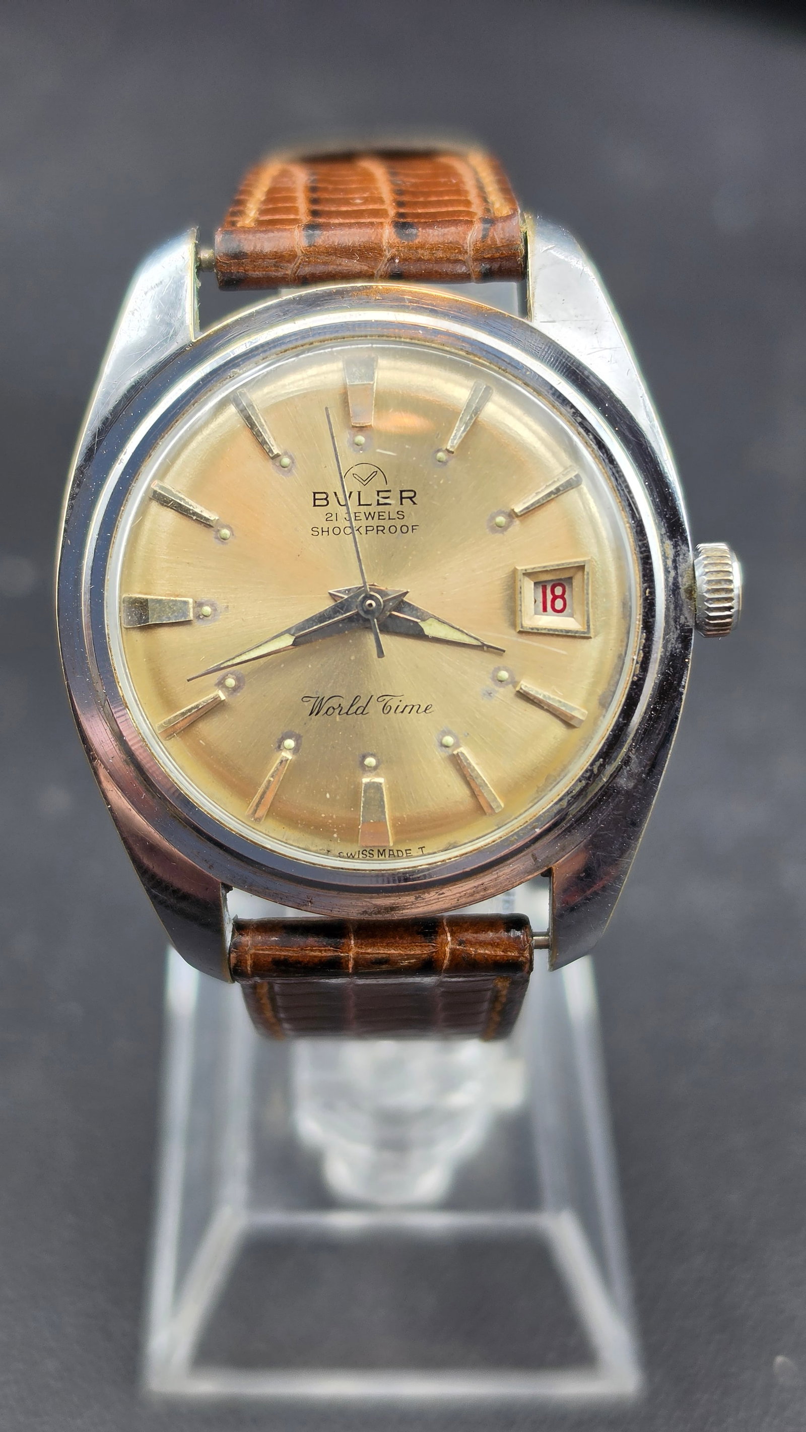 Vintage 1960s Buler World Time 21 Jewel Shockproof Date Swiss Watch Ref 1286C 36mm Running: Up for sale is a vintage Buler "World Time" Swiss-made manual-wind dress watch dating to the mid-1960s. The round chrome-plated case measures approximately 36mm wide and carries a warm champagne sunbu