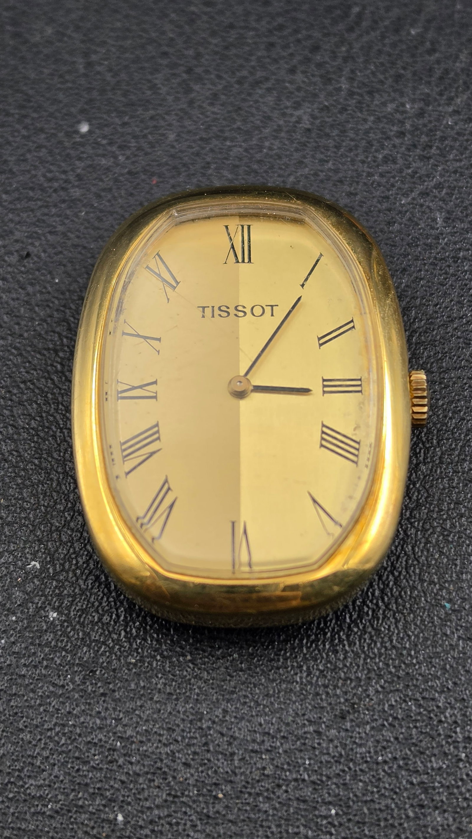 1970s Tissot Ladies Manual Wind Dress Watch Cal 2404 17 Jewel Gold Plated Barrel Case 25mm Head Only: This is a vintage 1970s Tissot ladies' manual-wind dress watch powered by the Tissot caliber 2404, a 17-jewel Swiss manual-wind movement serial number S96689. The case band is stamped with the Swiss "