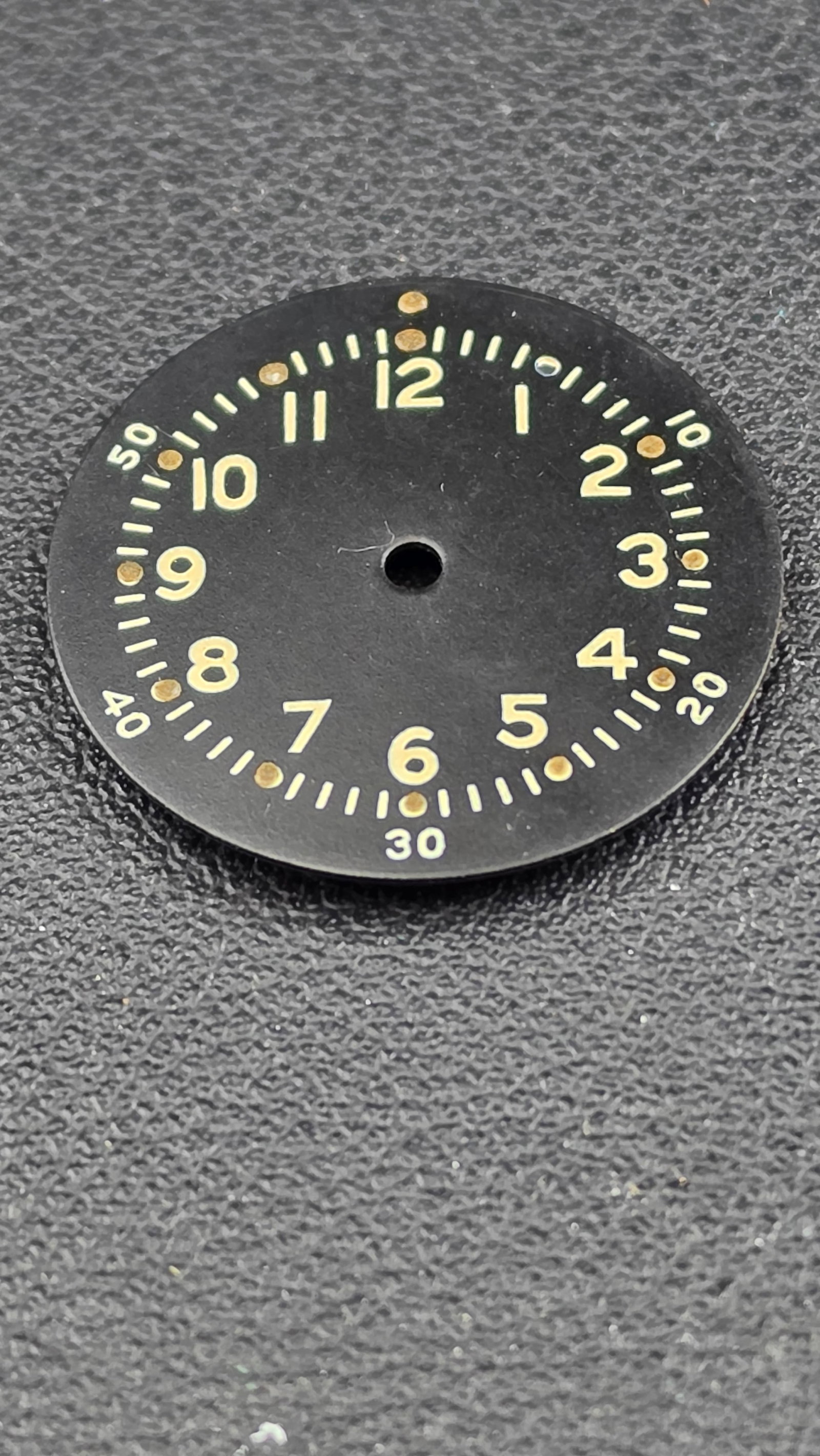 Vintage Military Aviator Flieger Type B Watch Dial Matte Black Aged Lume Arabic Numerals 25mm Unsign: This is a loose vintage watch dial in the classic Type B military aviator Flieger configuration, featuring a matte black ground with cream-aged luminous Arabic numerals running 1 through 12, an outer 