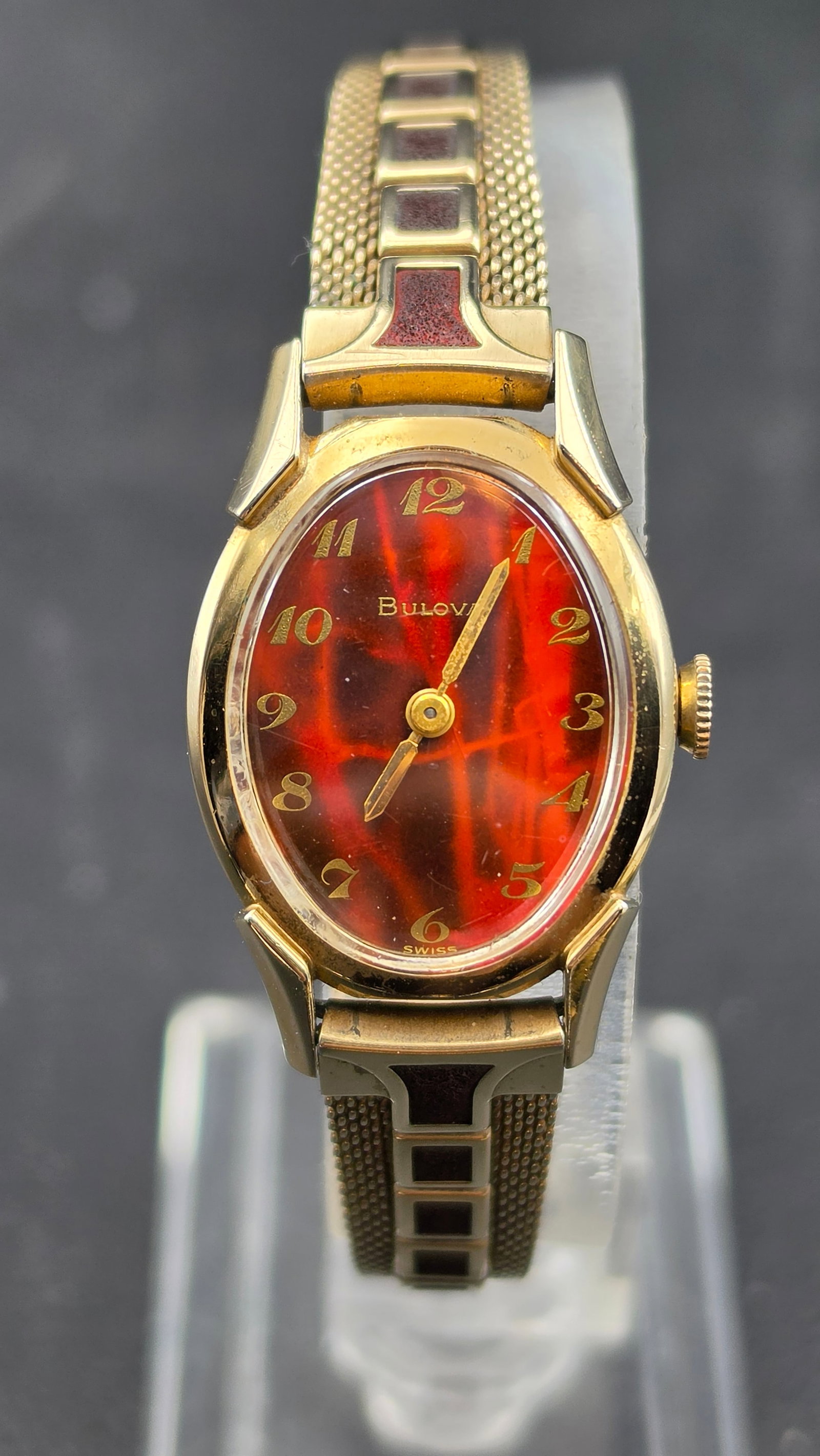 1961 Bulova Ladies 17J Mechanical Oval Watch Amber Flame Dial 10K RGP Duchess Bracelet 22mm: Up for sale is a vintage ladies Bulova mechanical wristwatch dating to 1961–1962, confirmed by the N1 date code stamped on the case back alongside serial number R220307 and the marking "10 KT. Rolle