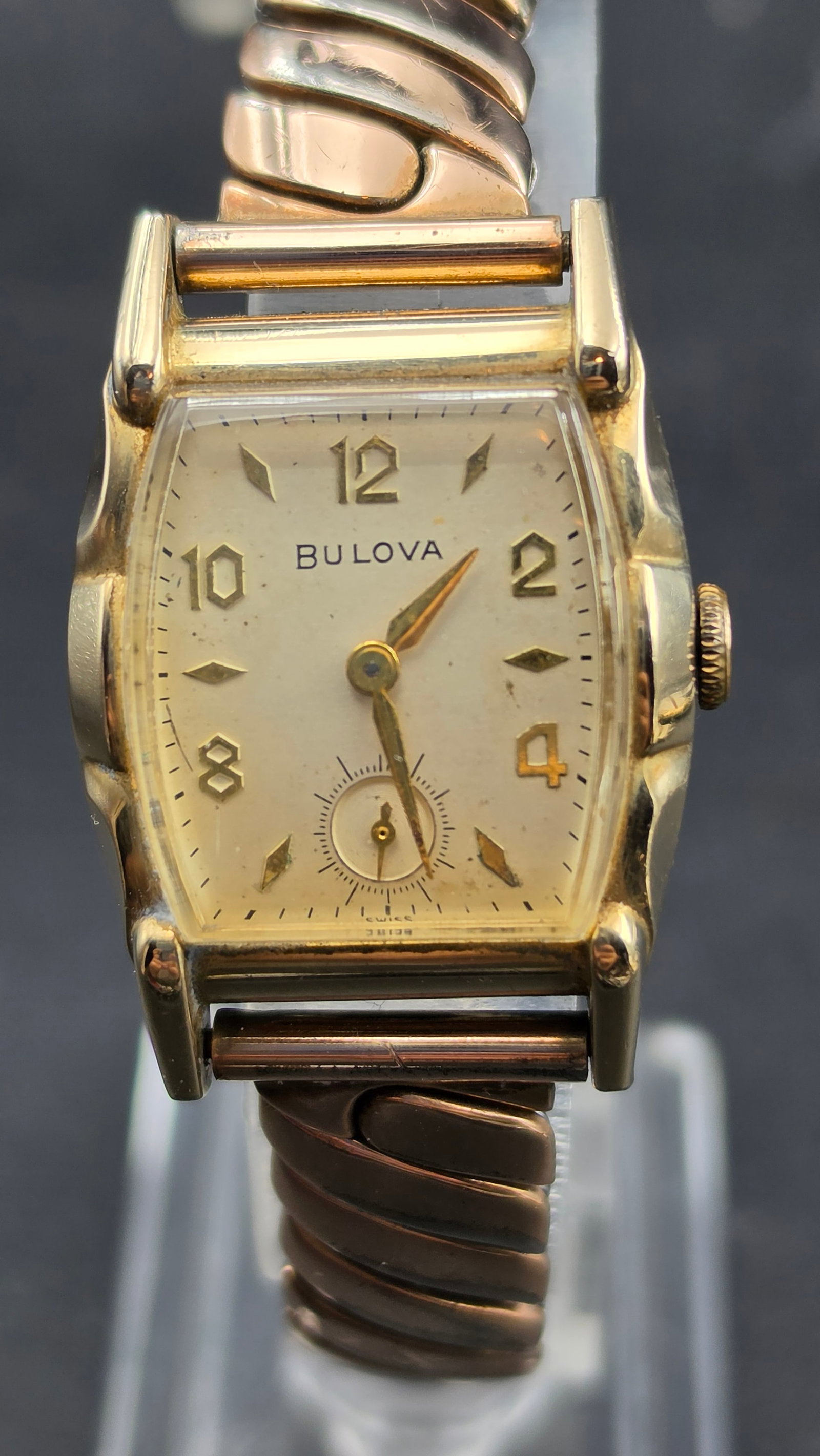 1954 Bulova Men's 15J Manual Wind Tonneau Watch Cal. 10BT 12K GF Bracelet 25mm: Up for sale is a 1954 Bulova men's manual wind wristwatch, confirmed by the L4 date code stamped on the case back alongside serial number 7874210. The watch is powered by Bulova caliber 10BT, a 15-jew