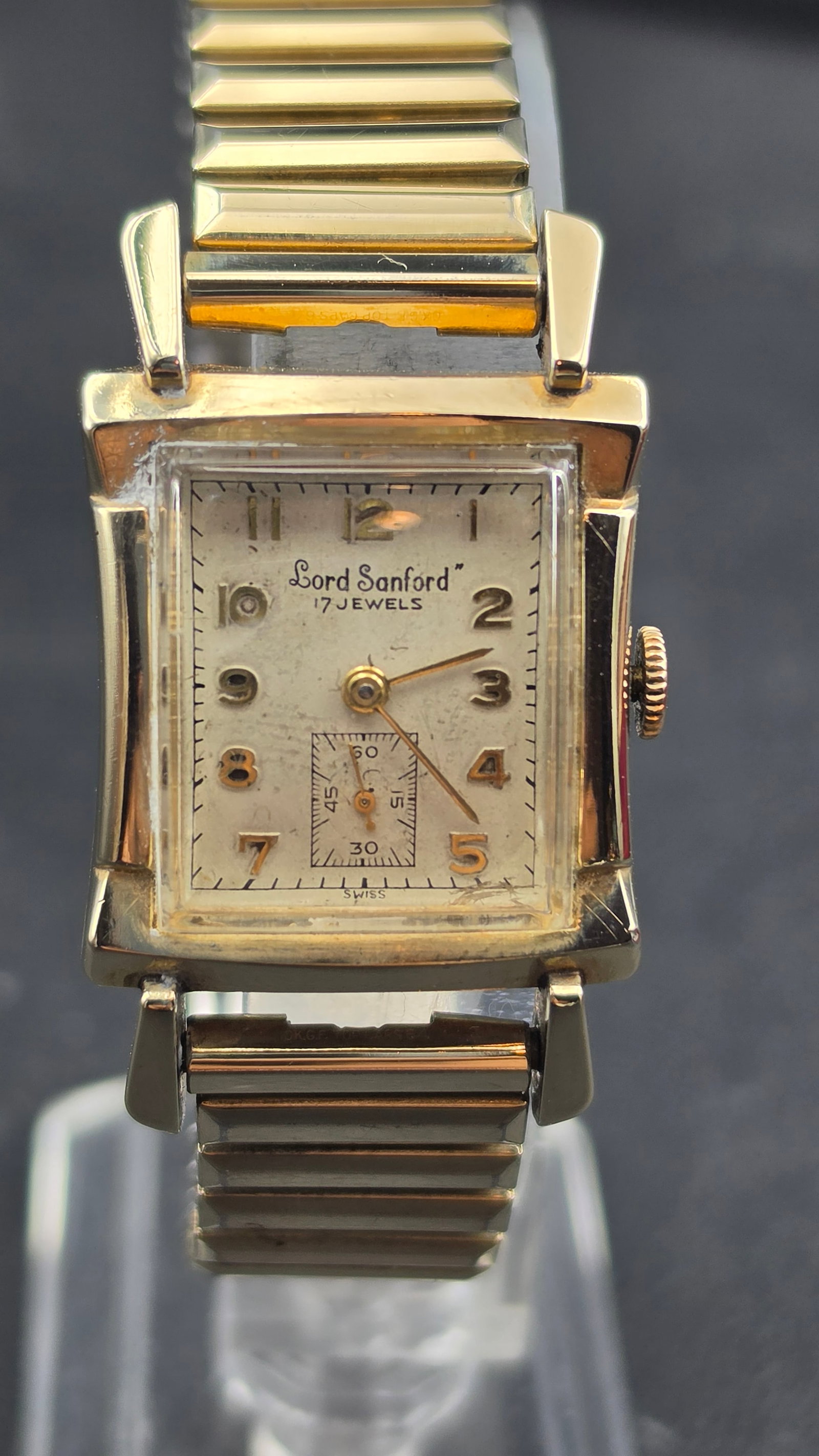 Vintage 1950s Lord Sanford 17 Jewel Swiss 10K Gold Filled Watch Kewa Movement w/ Box: This is a vintage mid-1950s Lord Sanford 17-jewel Swiss manual-wind wristwatch in a 10K gold-filled Lapwell case, serial 123066, complete with its original red crocodile-embossed presentation box. The