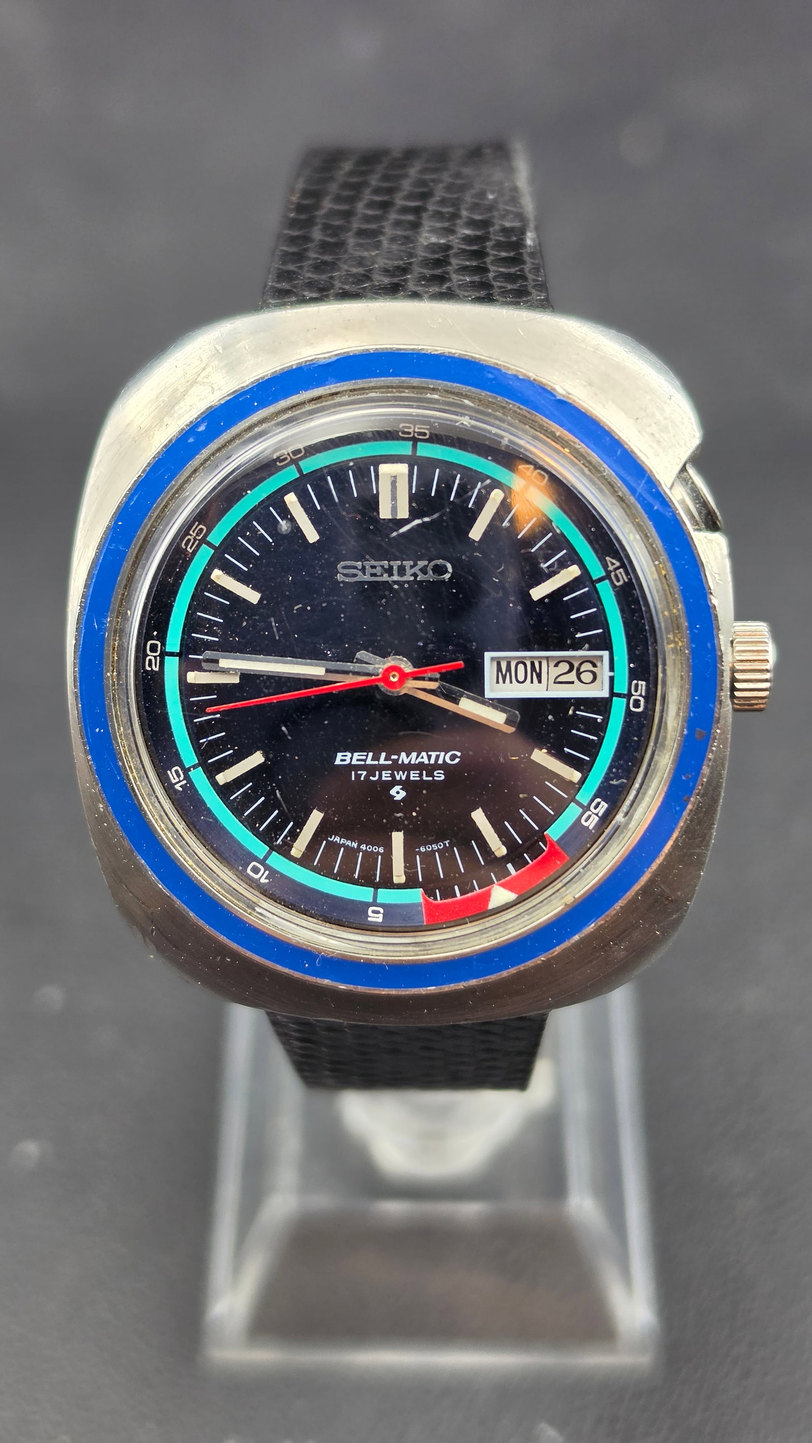 1973 Seiko Bell-Matic 4006-6027 Blue Bezel Automatic Alarm 17J Day Date Black Dial Running: Up for sale is a 1973 Seiko Bell-Matic, reference 4006-6027, one of the most iconic and desirable variants in the entire Bell-Matic lineup. The case back is stamped Stainless Steel, 4006-6027, Water R