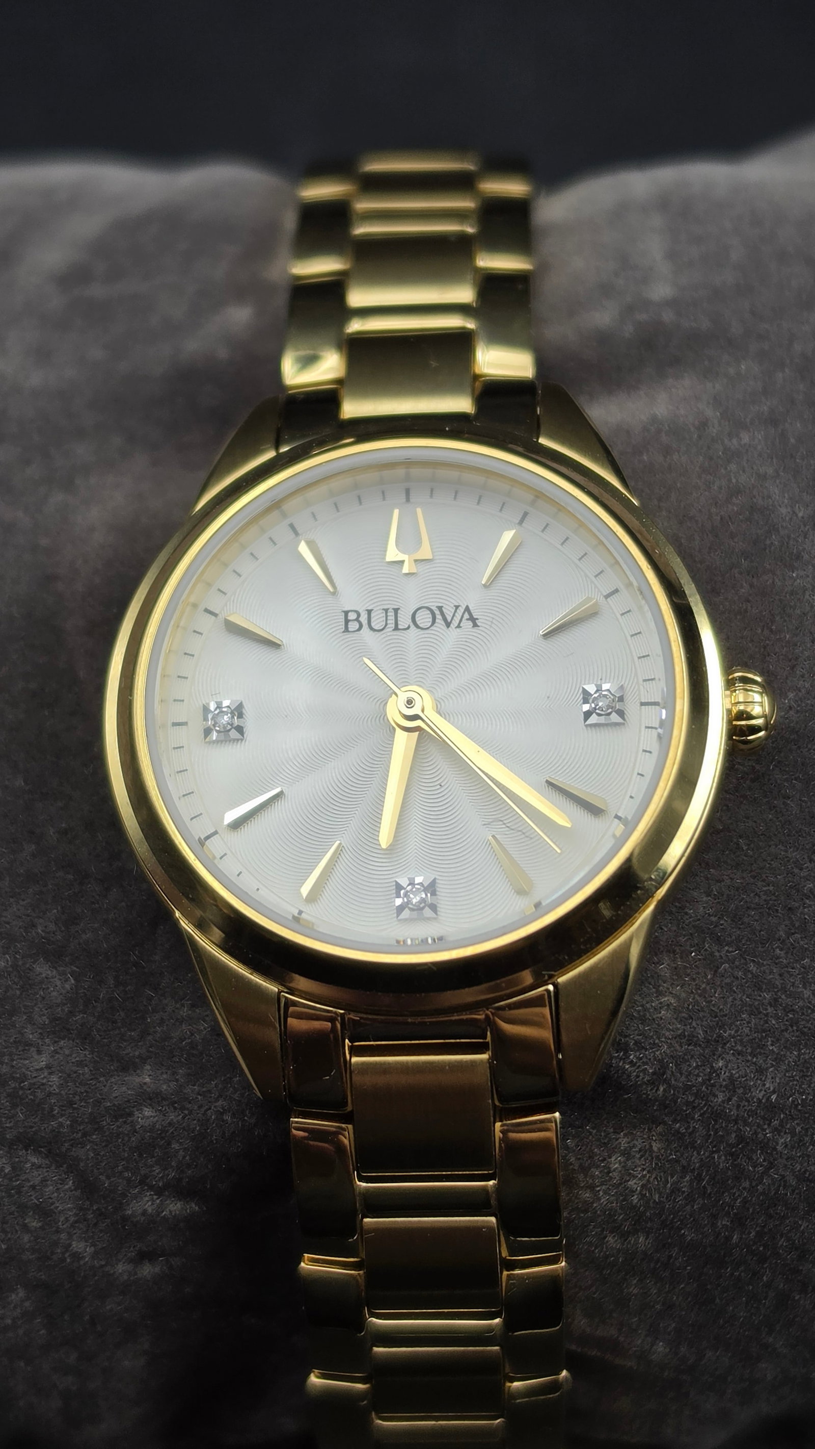 Bulova Sutton 97P150 Ladies Diamond Accent Gold-Tone 28mm Quartz Watch Box & Papers Unworn: Up for sale is a Bulova Sutton ladies' quartz wristwatch, reference 97P150, new and unworn in the original box with all papers and original retail hang tag intact. The white sunburst guilloche dial is