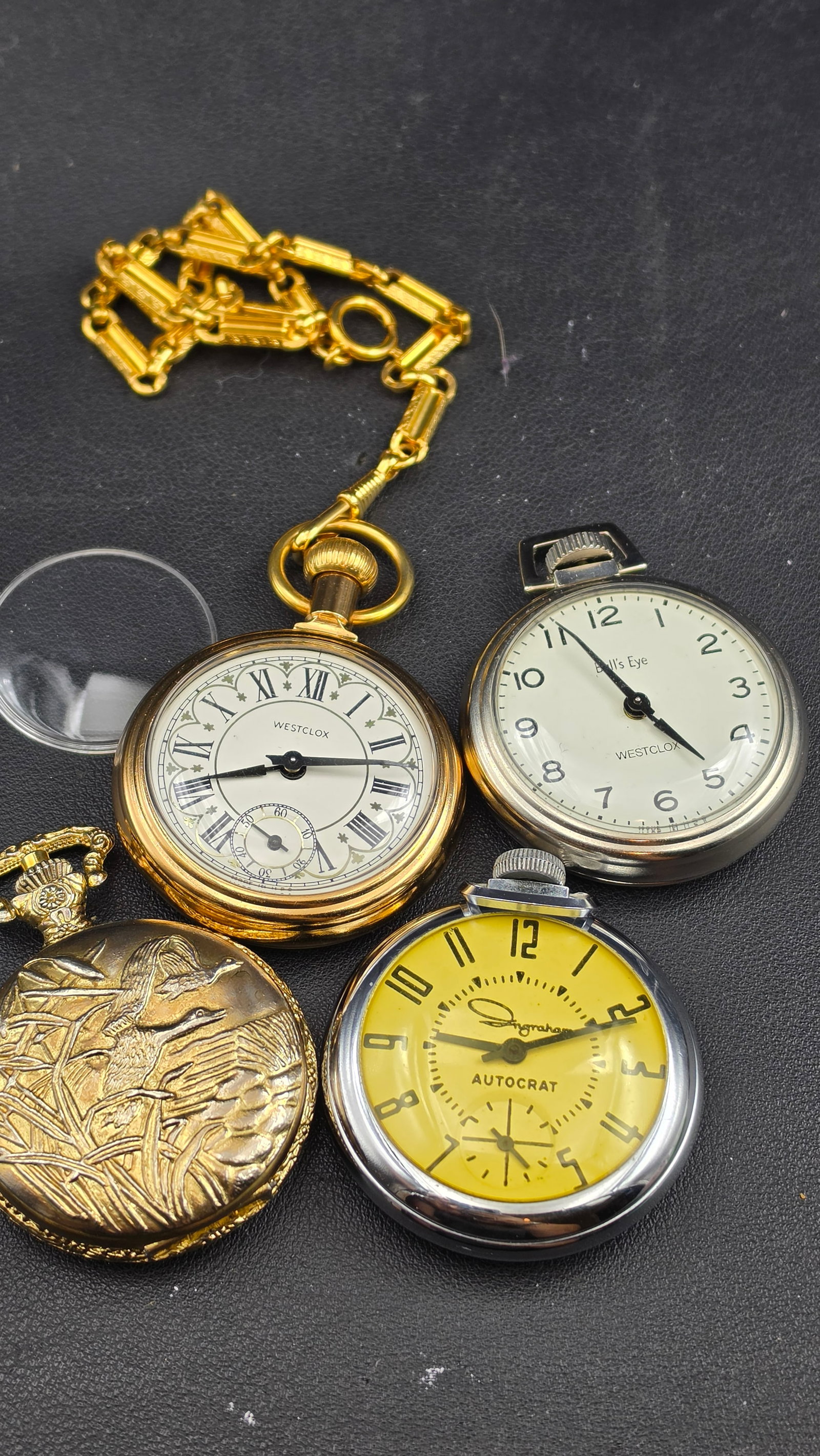 Vintage Pocket Watch Lot Westclox Bull's Eye Ingraham Autocrat Luxury Hunter Case 1940s-1970s: This lot includes four vintage pocket watches offering a nice variety of mid-century American and import timepieces. The Westclox Bull's Eye is a classic American open-face design in a chrome-tone cas