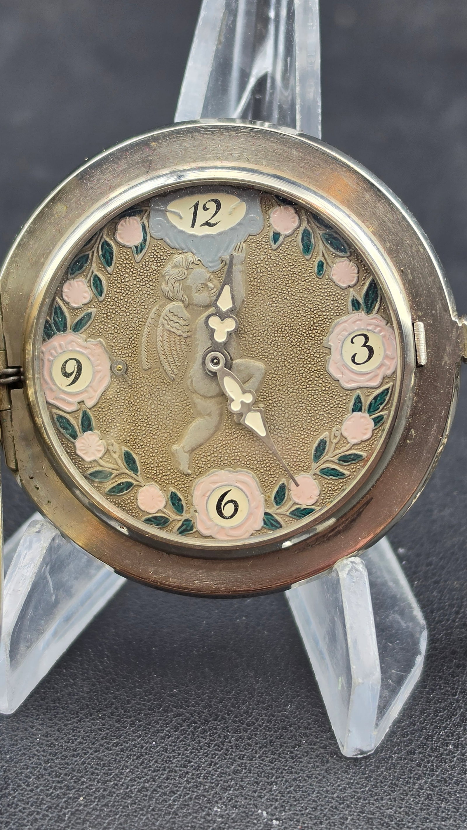 1970s Russian Molnija 18 Jewel Pocket Watch Cherub Enamel Dial Three Graces Repousse Hunter Case: This is a genuine Russian Molnija pocket watch housed in one of the most visually striking combinations of case and dial encountered in Soviet-era horology. The dial is an extraordinary painted or ena