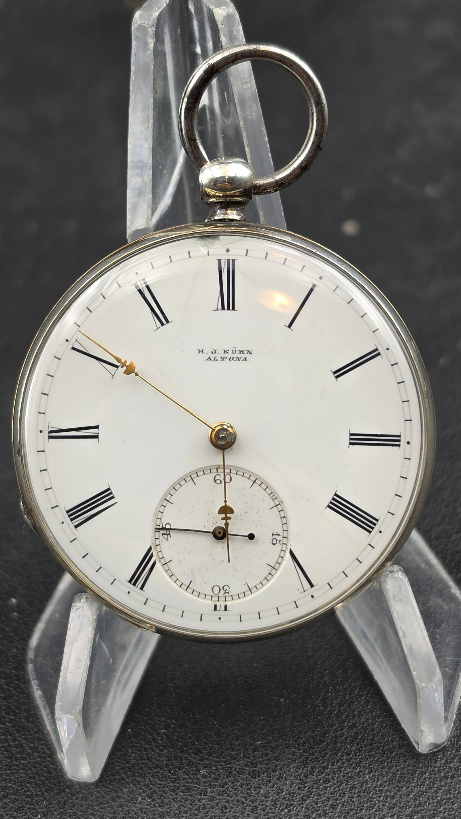 Antique c.1875 H.J. Kühn Altona Silver Pocket Watch Swiss Movement 6 Jewel Open Face Enamel Dial: Up for auction is a genuine antique open-face pocket watch signed H.J. Kühn, Altona — a watchmaker and retailer based in the historic port city of Altona (now part of Hamburg, Germany). The white e