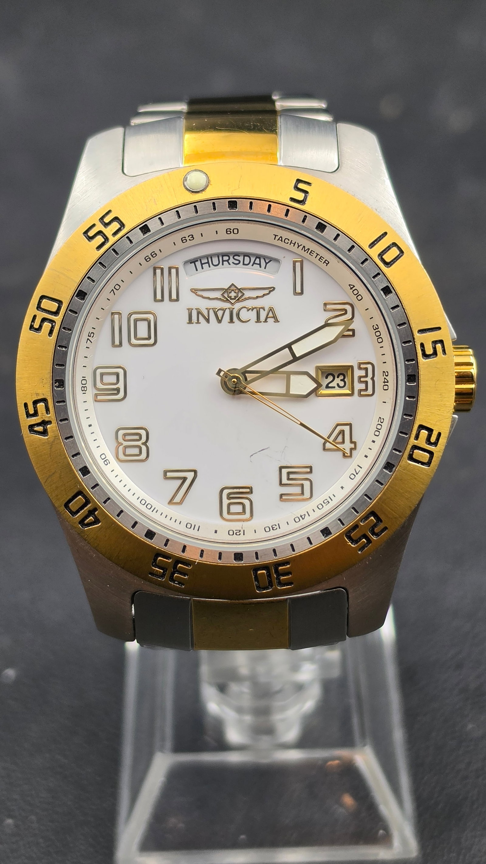 Invicta Specialty Collection 6693 Two-Tone Gold Tritnite Day-Date White Dial Watch 44mm circa 2000s: This is an Invicta Specialty Collection reference 6693, the two-tone variant of the "Making History" Tritnite Night Glow series, pairing a gold-tone bezel and accents against a stainless steel case fo