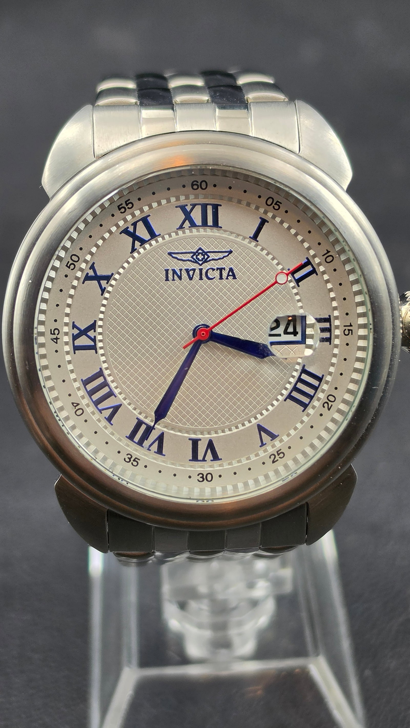 Invicta Specialty Collection Making History Tritnite Model 15356 Silver Guilloché Blue Roman: Up for sale is an Invicta Specialty Collection "Making History" Tritnite Night Glow, Model No. 15356, a clean dress-sport crossover from Invicta's Specialty line. The stainless steel case presents a s