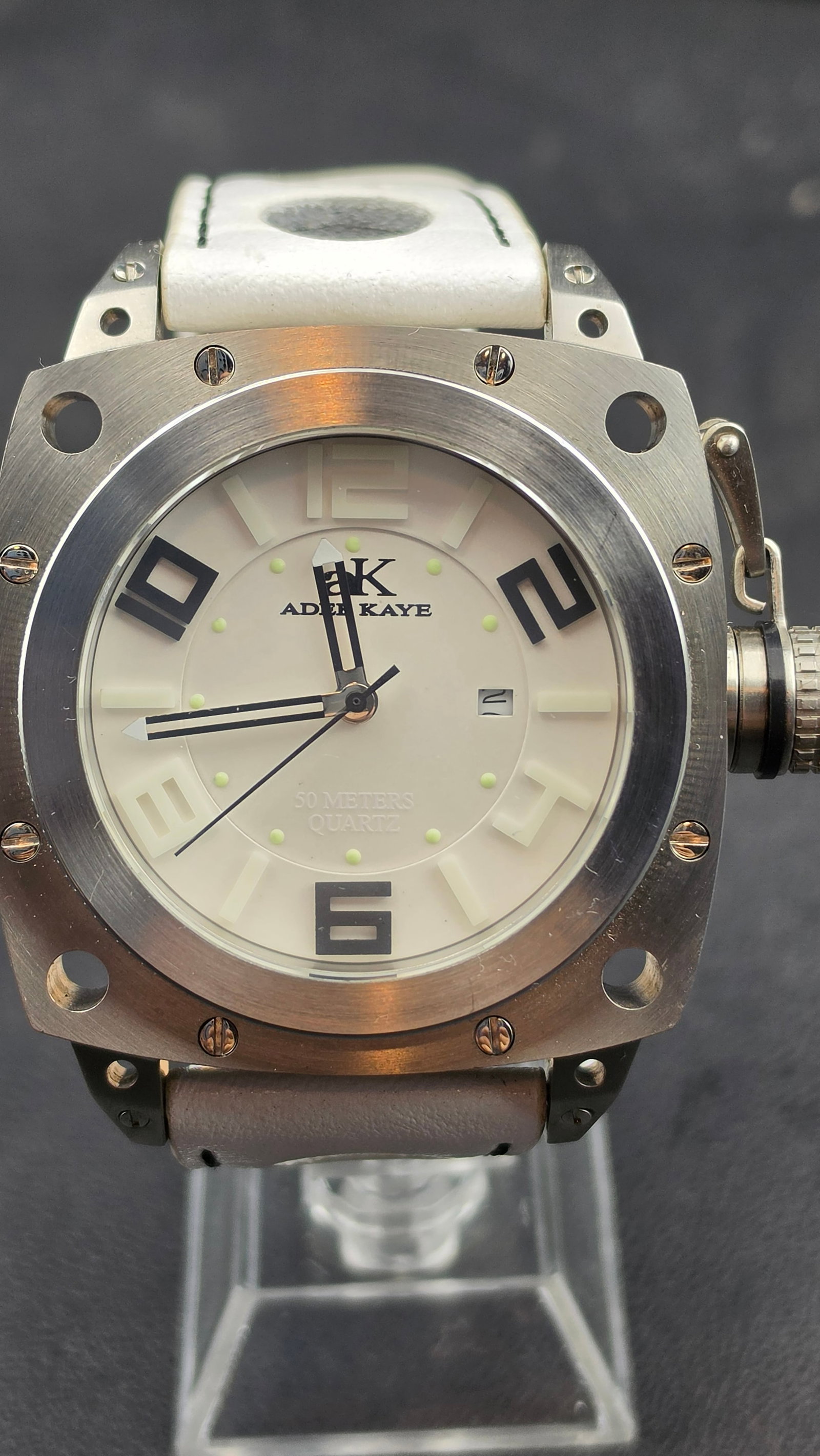 Adee Kaye AK7271-M NOS 49mm Square Brushed Steel White Dial Japan Quartz Racing Strap Men's Watch: Adee Kaye reference AK7271-M, NOS example in excellent unissued condition. The 49.41mm brushed stainless steel case features a bold square form with heavily rounded corners, exposed corner drill-holes