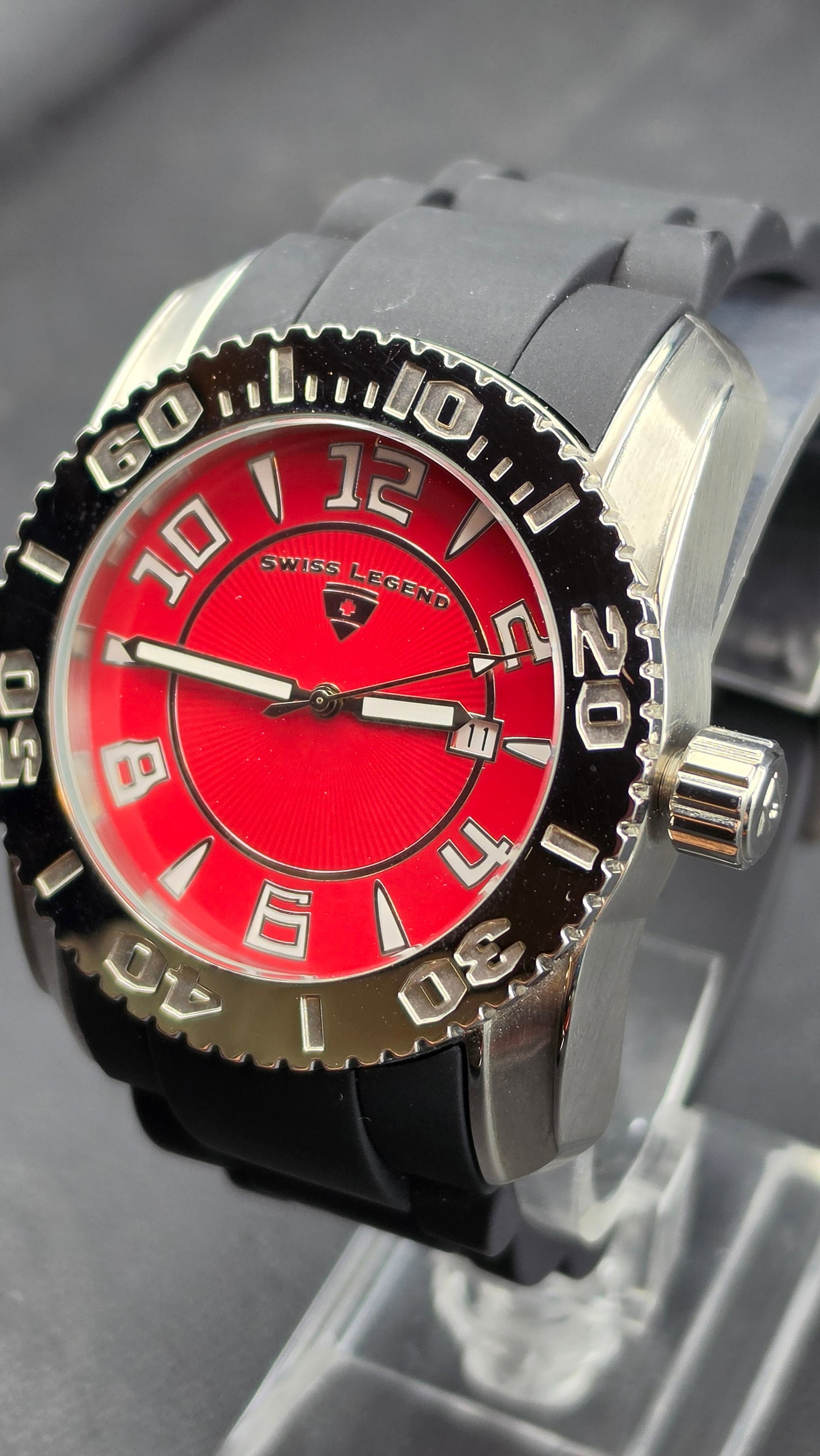 Swiss Legend Commander NOS 45mm Red Dial Swiss Movement 10ATM Sport Diver Black Rubber Strap: Swiss Legend Commander, NOS example in excellent unissued condition. The 45.72mm 316L stainless steel case features a bold barrel-form profile with a black unidirectional dive bezel carrying large pol