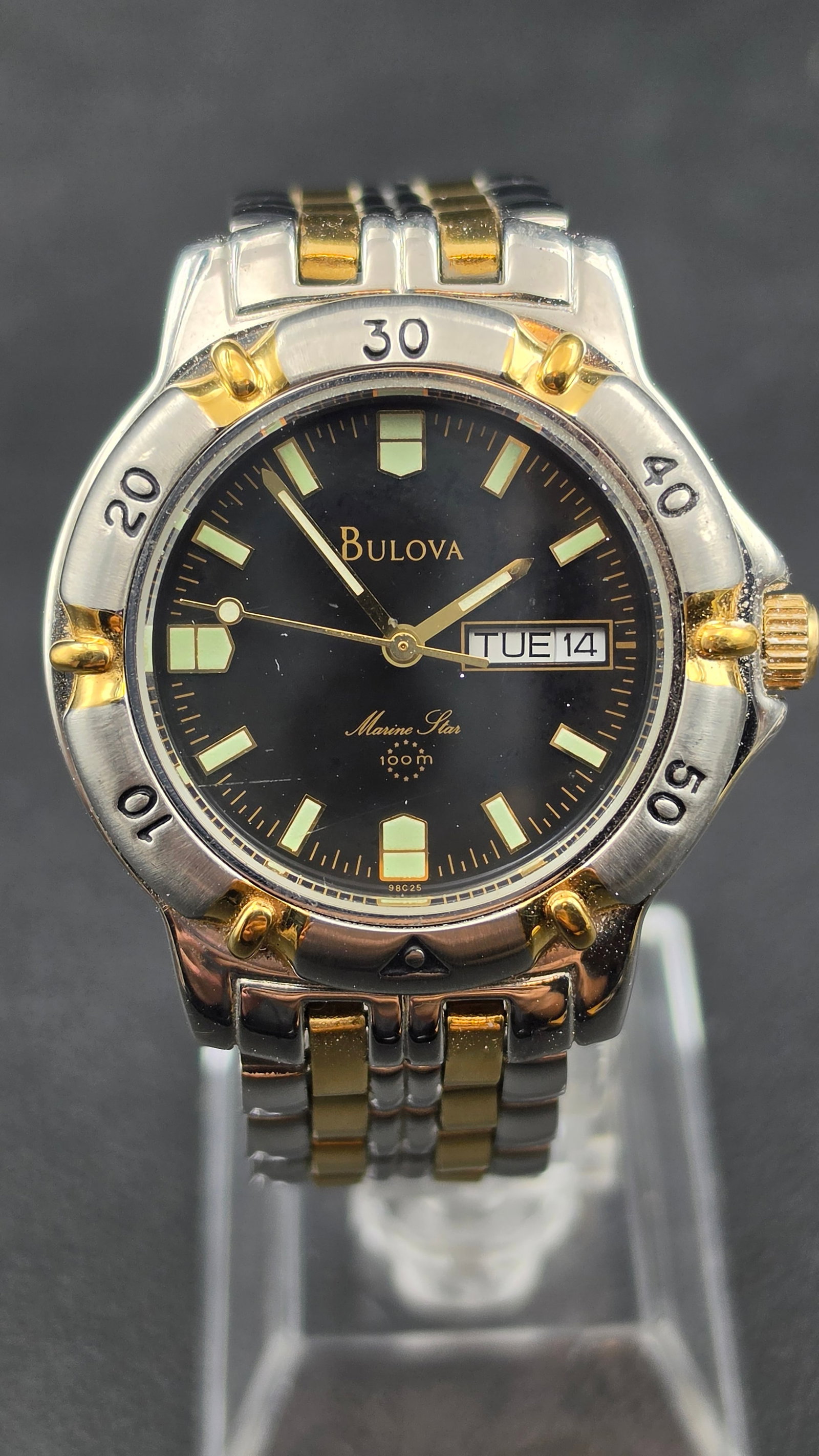 1998 Bulova Marine Star 100m Day-Date Black Dial Two-Tone Bracelet Quartz Watch 37mm Running: This is a Bulova Marine Star sport quartz watch, reference 98C25, dating to 1998 per the date code on the dial. The round stainless steel case measures 37.16mm and features a two-tone rotating diver-s