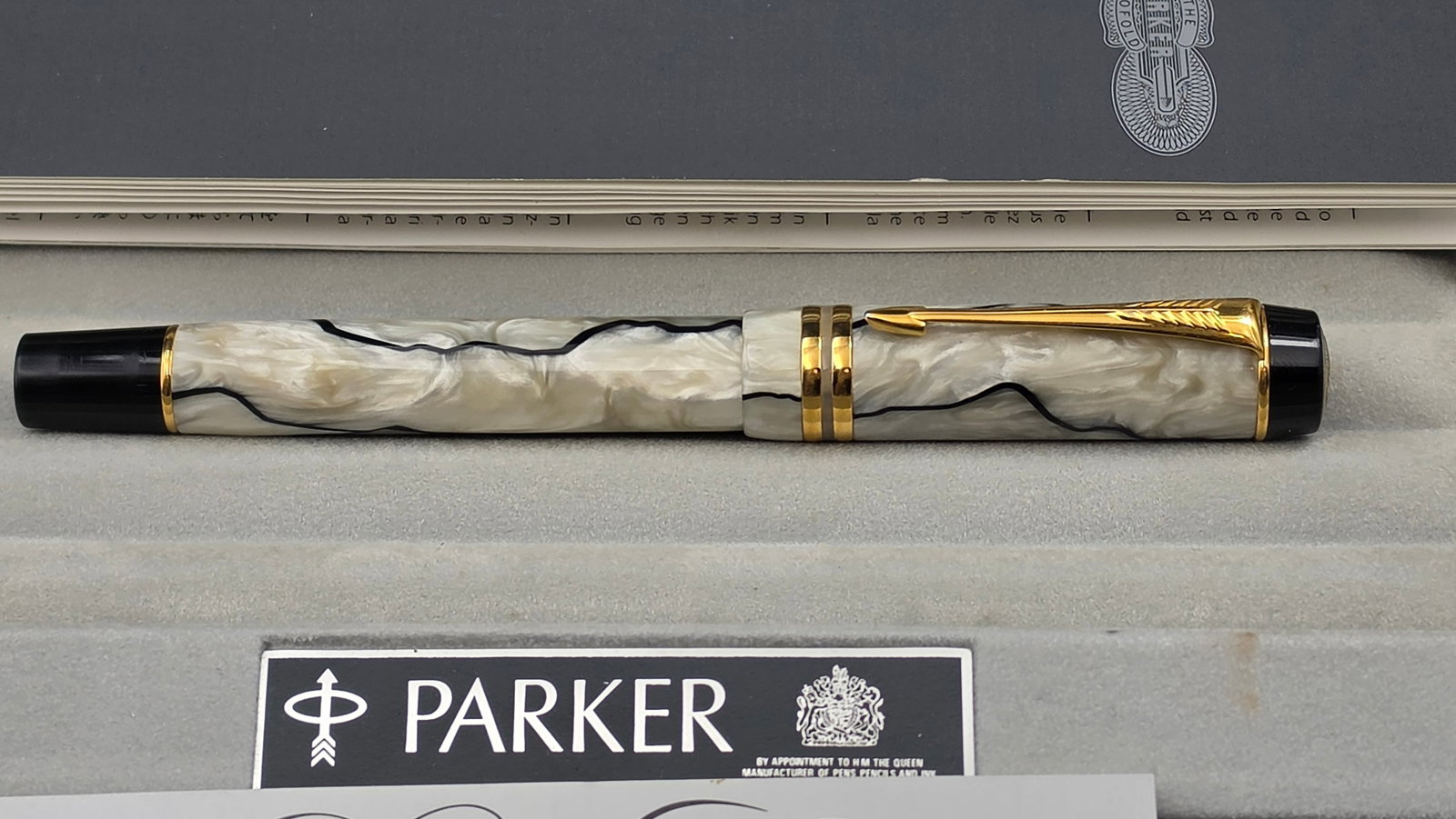 Parker Duofold Centennial Rollerball Pen Pearl & Black Gold Trim c.1993 Box Papers NOS: RARE FIND: This is a near-new-old-stock Parker Duofold Centennial rollerball pen in the highly sought Pearl and Black colorway, presented in its complete original packaging with full documentation. Th