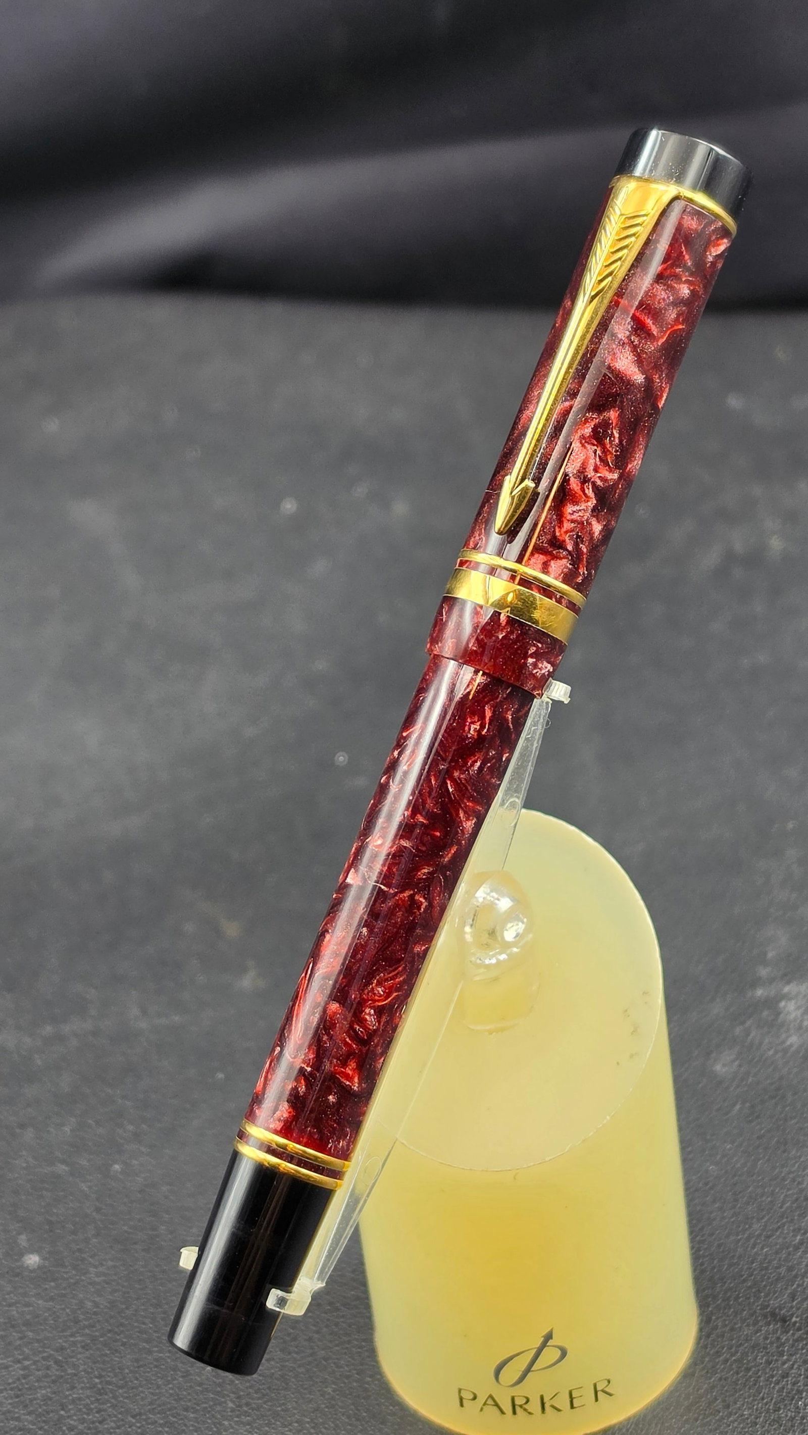 Parker Duofold Centennial Rollerball Pen Burgundy Red Marble Gold Trim c.1990s: Parker Duofold Centennial rollerball pen in deep burgundy red marble acrylic with gold-plated trim, barrel stamped "PARKER" at the cap band junction with double gold-filled trim rings at the cap and b