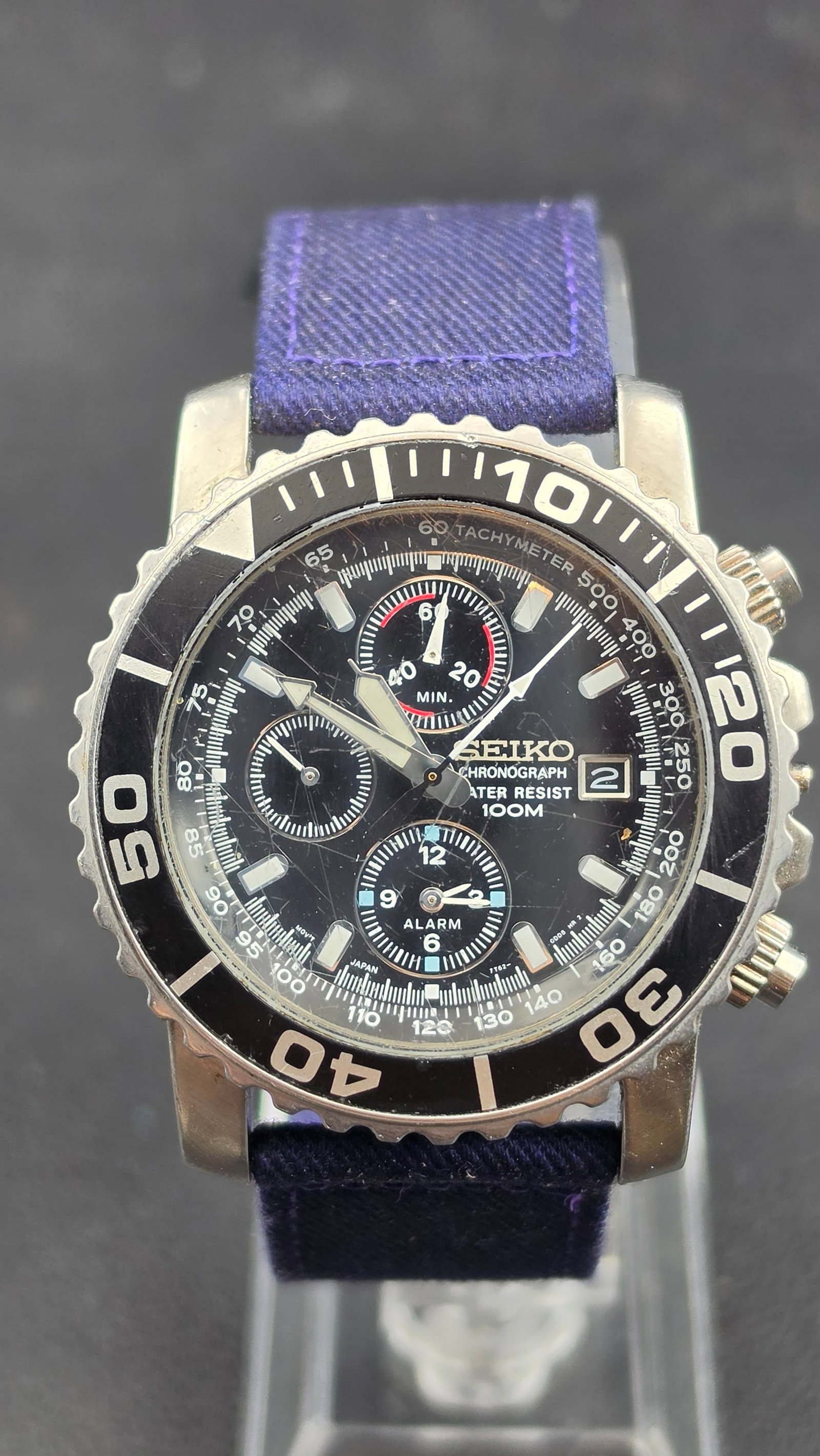 Seiko Chronograph Alarm 7T32 Tachymeter Diver-Style Stainless Steel Watch 44mm Water Resist 100M, ca: This is the Seiko Chronograph Alarm, caliber 7T32, reference 511146, a multi-function quartz sport watch featuring a black dial with "SEIKO / CHRONOGRAPH / WATER RESIST / 100M" text, lume bar hour mar