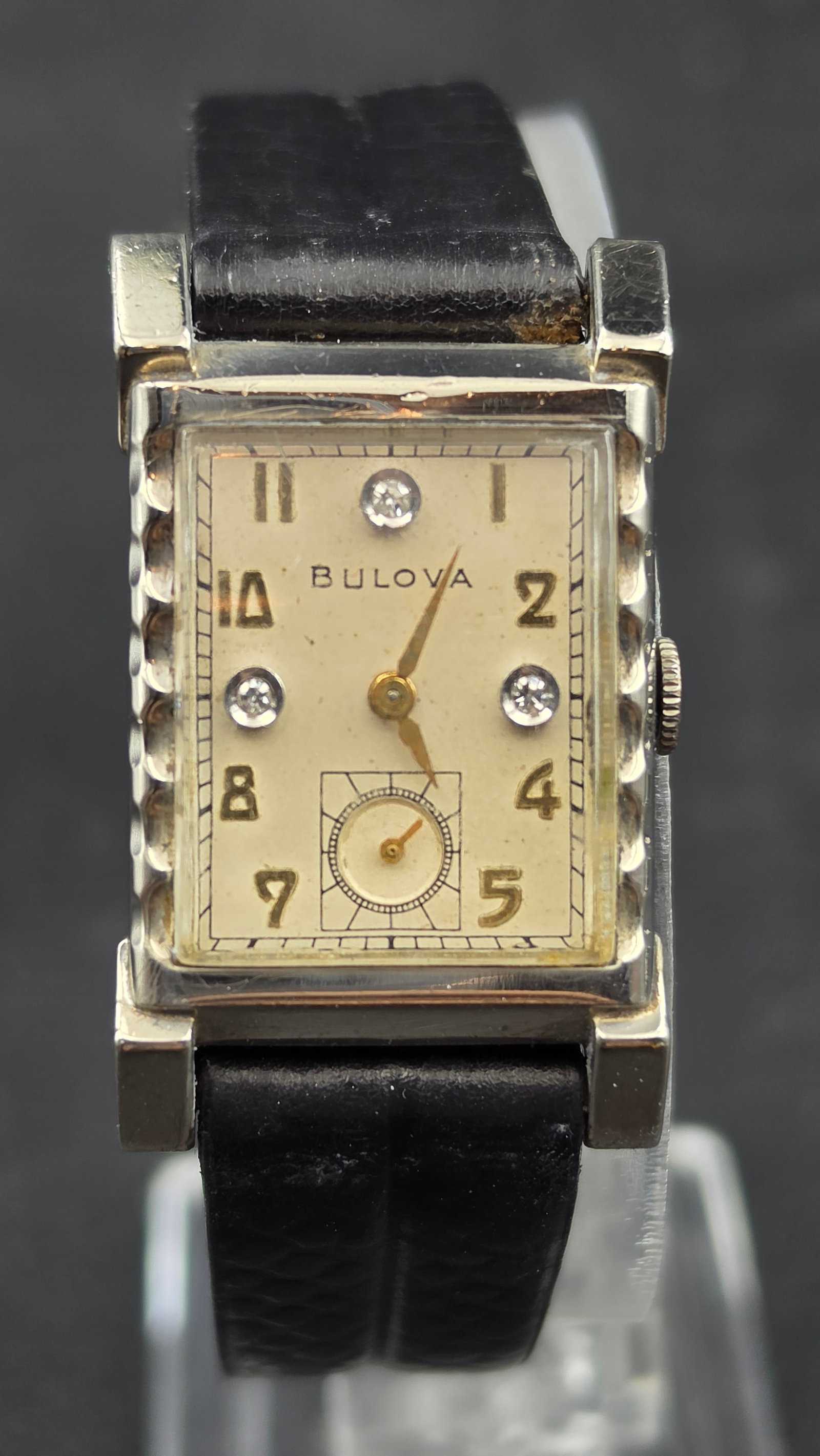Bulova 10K Rolled Gold Plate 17 Jewel BAC Movement Diamond Dial Men's Tank Watch 22mm, 1948, Starts: This is a Bulova men's tank-style dress watch, case serial 1940478 (reading the reversed stamp), dating this to 1948 per Bulova's date code system. The cream dial features Arabic numerals, three flush